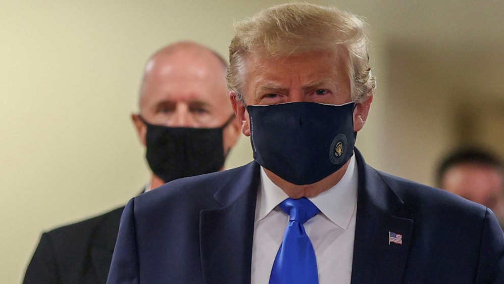 US President Donald Trump wearing a mask while visiting Walter Reed National Military Medical Center in Bethesda, Maryland, US