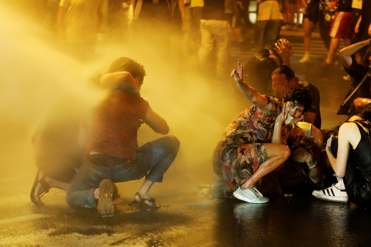 Police use water cannons as they clash with people during a protest against Israeli Prime Minister Benjamin Netanyahu and his government''s response to the financial fallout of the coronavirus disease