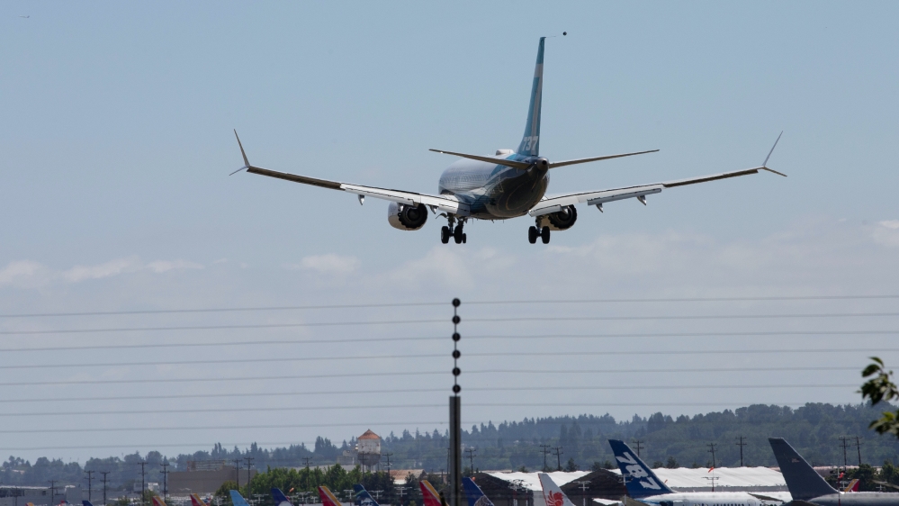 A Boeing 737 MAX aeroplane lands after a test flight at Boeing Field in Seattle [Reuters]