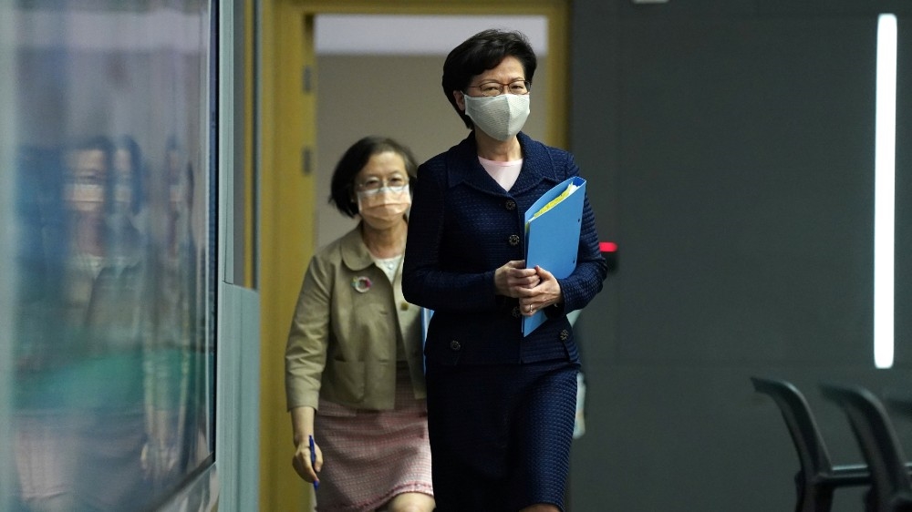 Hong Kong Chief Executive Carrie Lam, wearing a face mask following the coronavirus disease (COVID-19) outbreak, arrives for a news conference