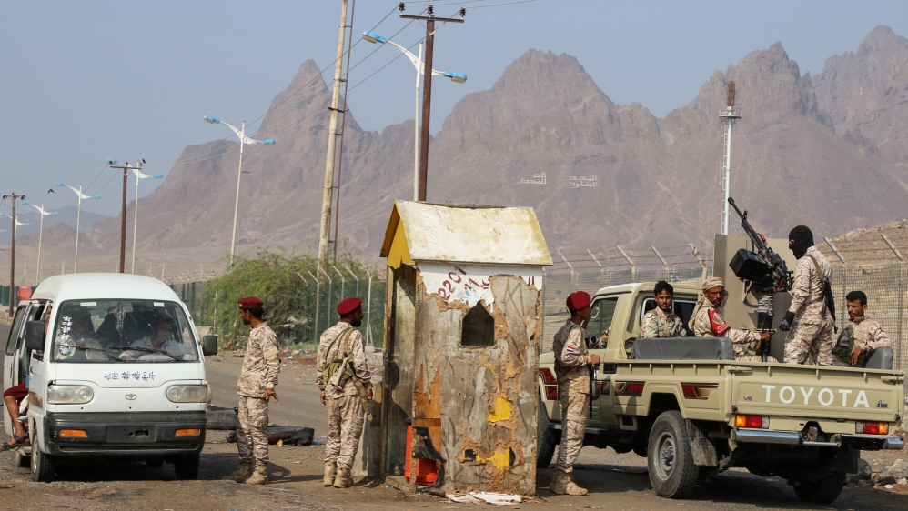 Southern Yemeni separatist security members patrol a road during a campaign to seize unlicensed motorcycles in Aden, Yemen