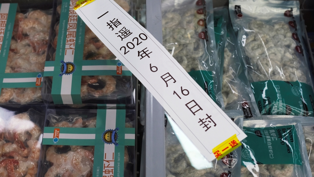 Frozen seafood products made of imported shrimps are seen inside a sealed freezer at a supermarket in Beijing