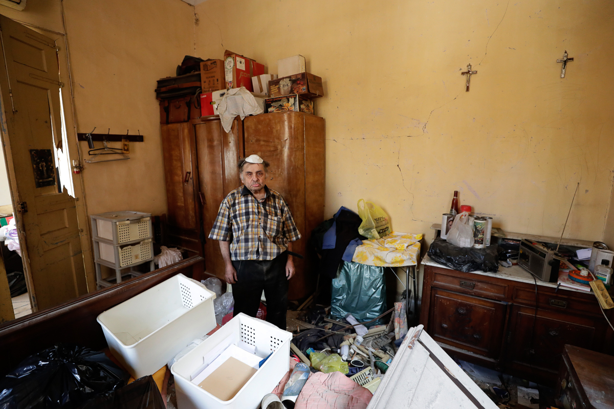 Waleed Mokbel, 78, poses for a photograph inside his destroyed apartment after Tuesday''s explosion in the seaport of Beirut, Lebanon, Thursday, Aug. 6, 2020. The gigantic explosion in Beirut on Tuesda