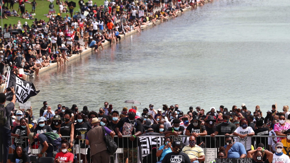 Demonstrators gather for the “Get Your Knee Off Our Necks” Commitment March on Washington 2020 in support of racial justice in Washington