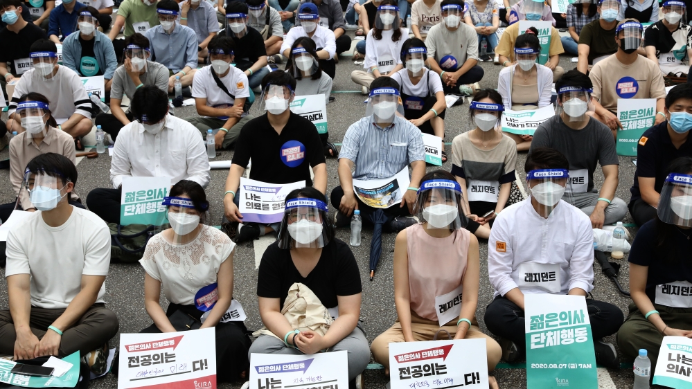 Interns and resident doctors participate in a rally against the government medical plan in Seoul, South Korea