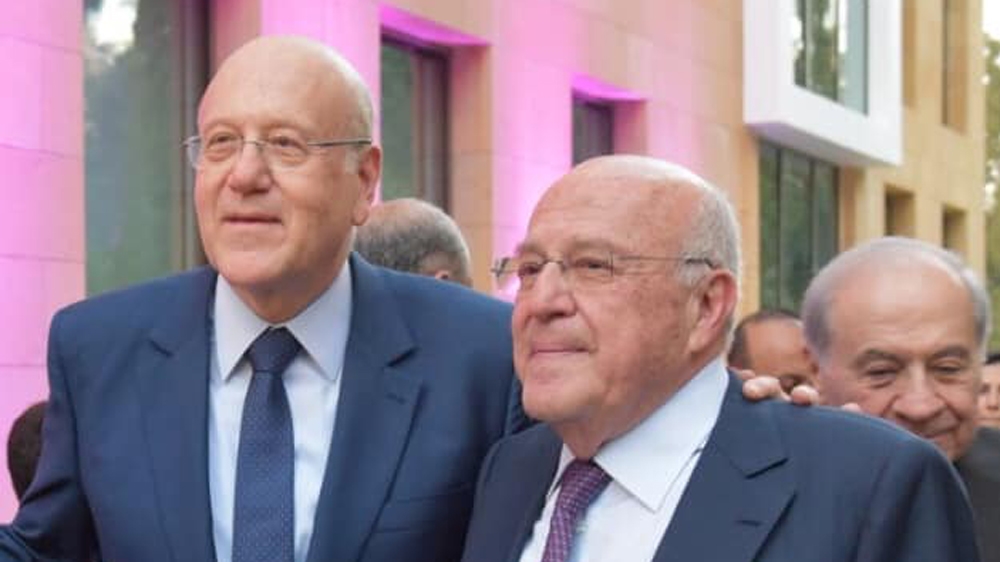 Taka Mikati, right, with his brother, former Prime Minister of Lebanon Najib Mikati [Facebook/Al Jazeera