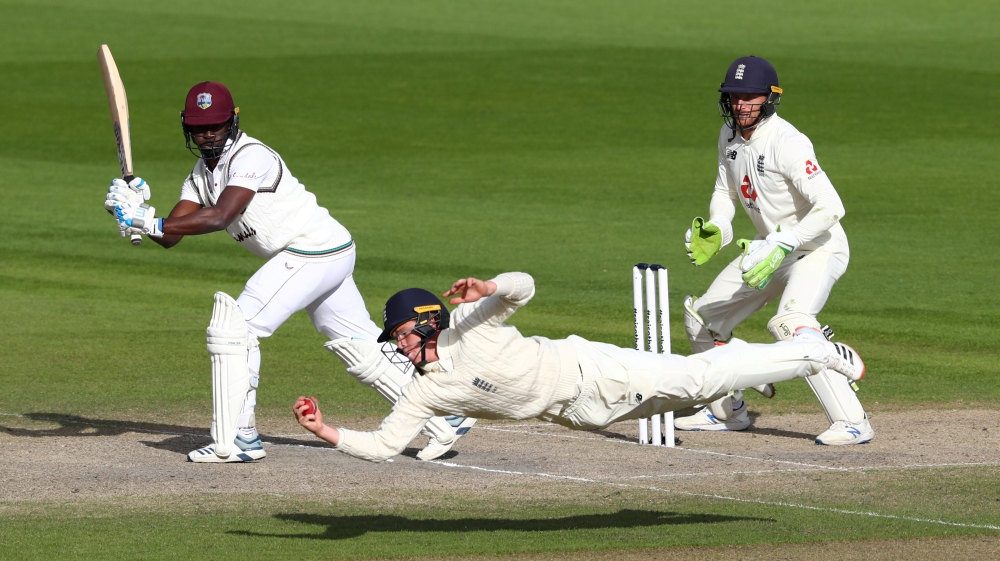 England’s Ollie Pope catches out West Indies’ Kemar Roach to win the second Test in Manchester, July 2020