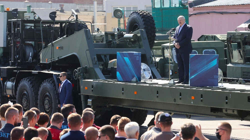 Belarusian President Alexander Lukashenko, right, addresses workers of the Minsk Wheel Tractor Plant in Minsk, Belarus, Monday, Aug. 17, 2020. Lukashenko visited Wheel Tractor Plant on Monday 
