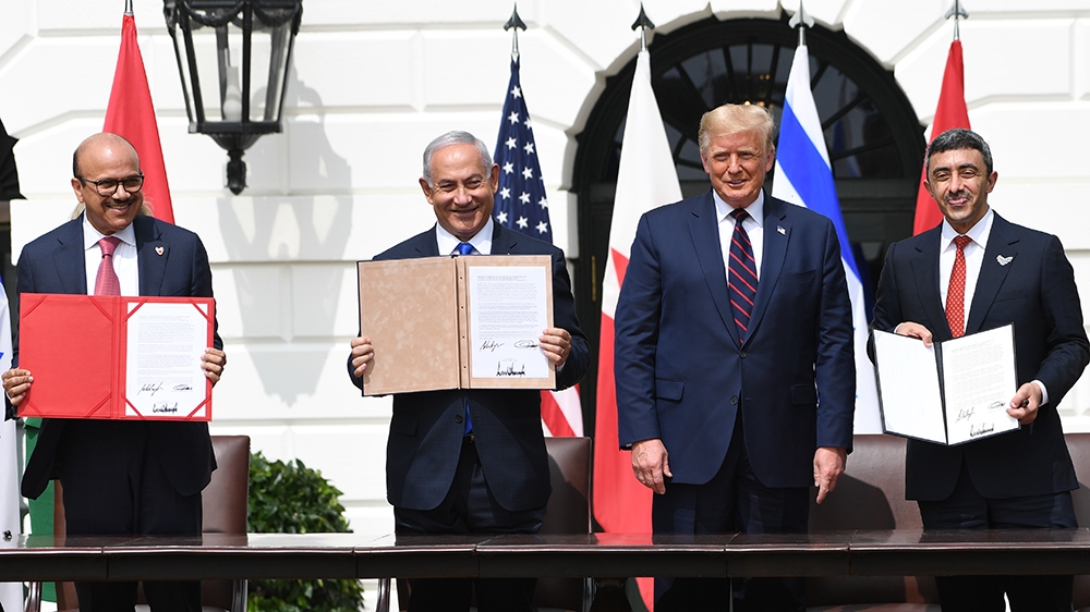 (L-R)Bahrain Foreign Minister Abdullatif al-Zayani, Israeli Prime Minister Benjamin Netanyahu, US President Donald Trump, and UAE Foreign Minister Abdullah bin Zayed Al-Nahyan participate in the signi