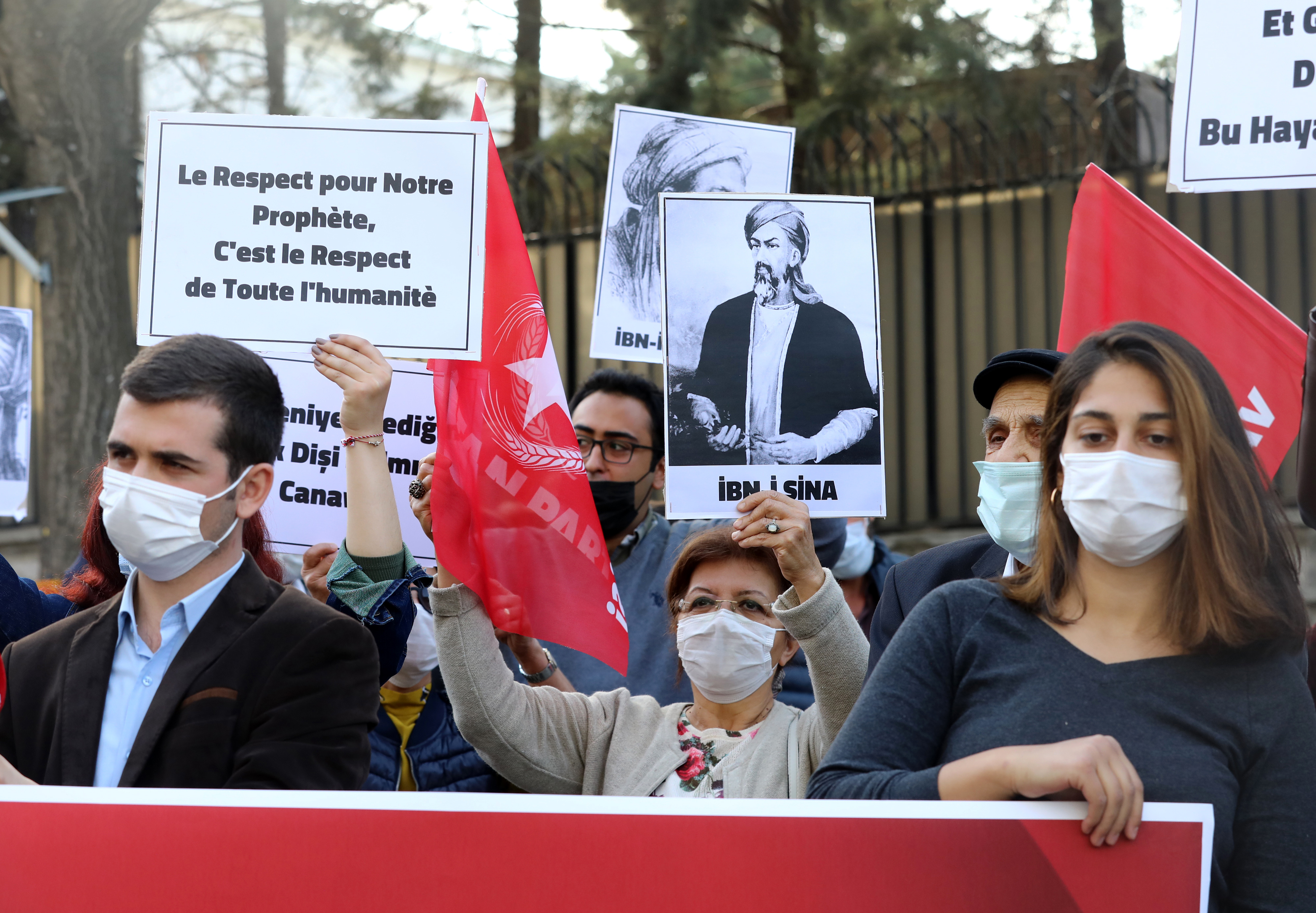 Demonstrators hold a sign reading “Respect for our prophet is respect for all mankind”n front of the French embassy in Ankara