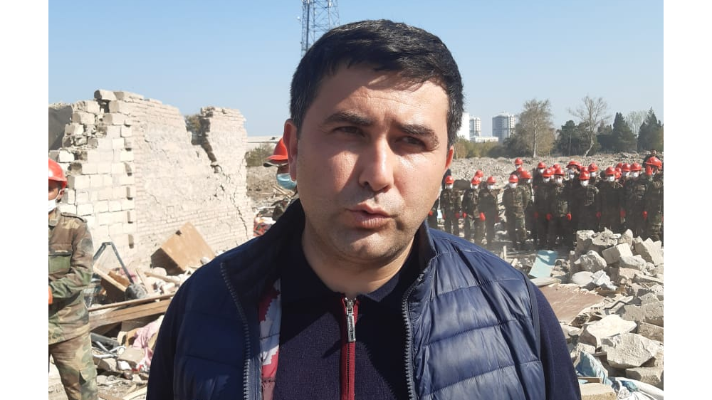Mushfiq Jafarov, MP from Ganja, speaks from the site of rubble after an alleged Armenian attack on the city