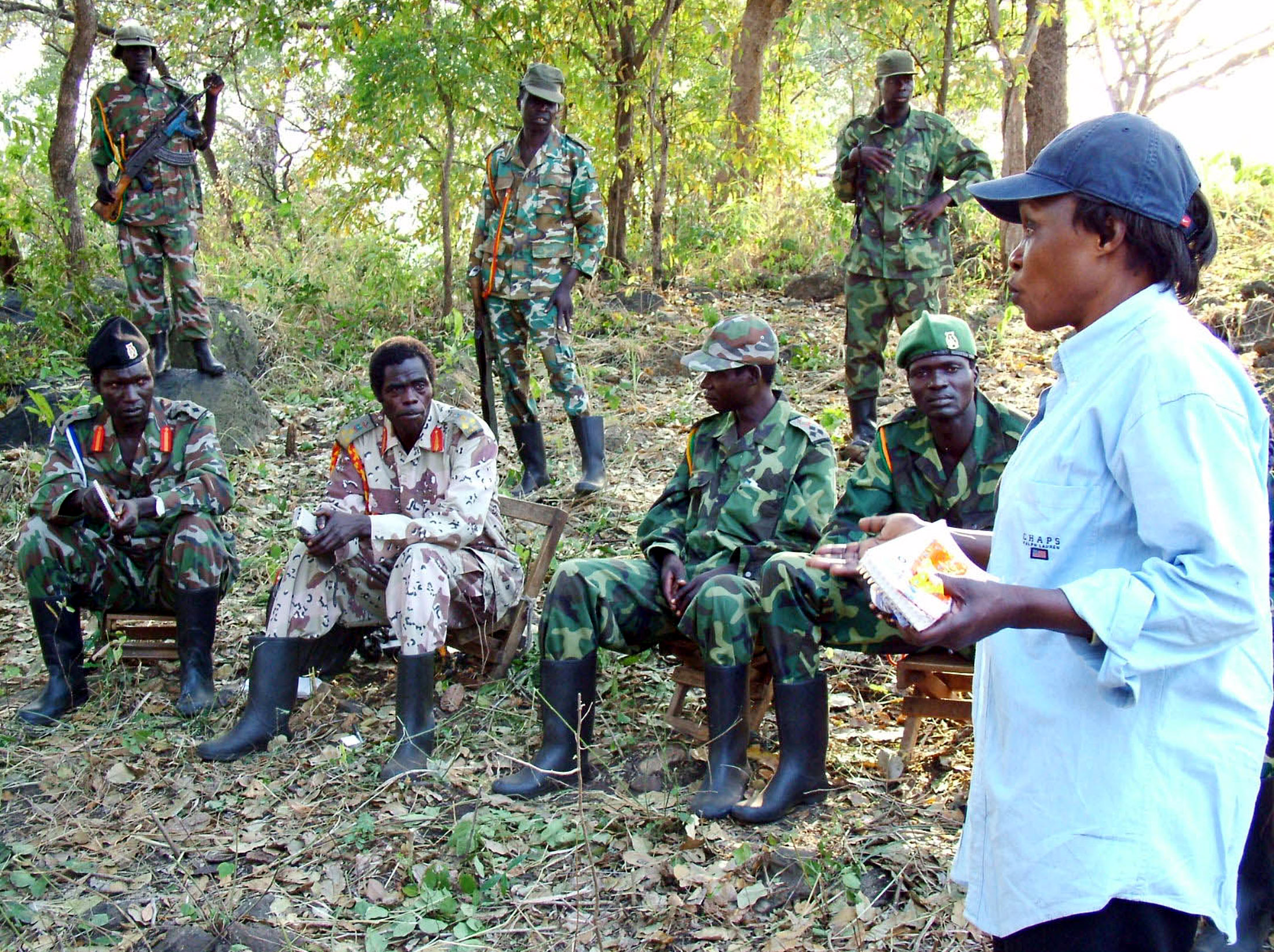 Betty Bigombe, right, talks to LRA rebel leaders in her capacity as Uganda's chief negotiator, in Palabek, near northern Ugandan-Sudan border on December 28, 2004 [File: James Akena/Reuters]