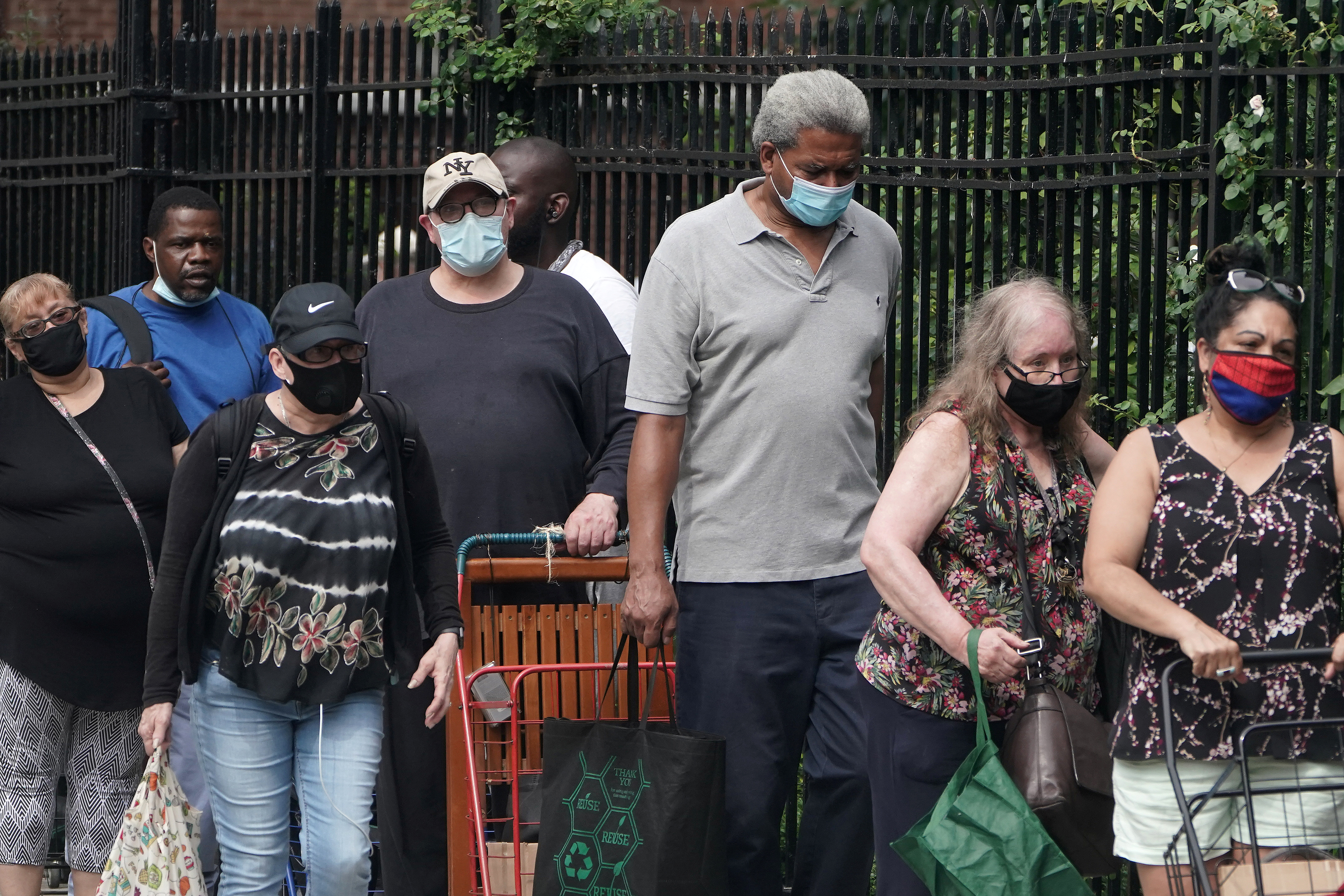 People line up at a food bank following the coronavirus outbreak in the Manhattan borough of New York City, New York, United States