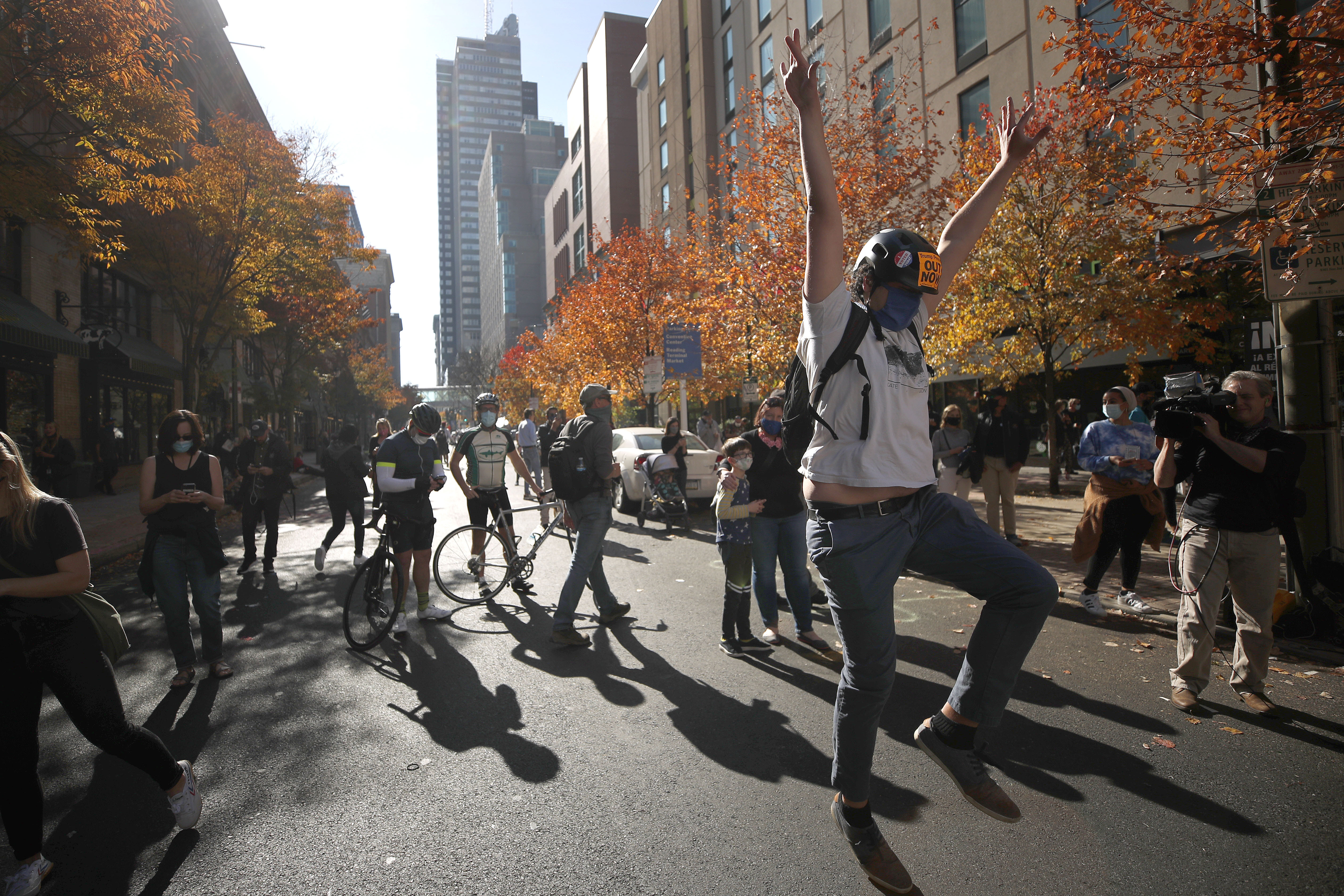 A man celebrates in Philadelphia after Democrat Joe Biden was projected winner in the 2020 presidential election