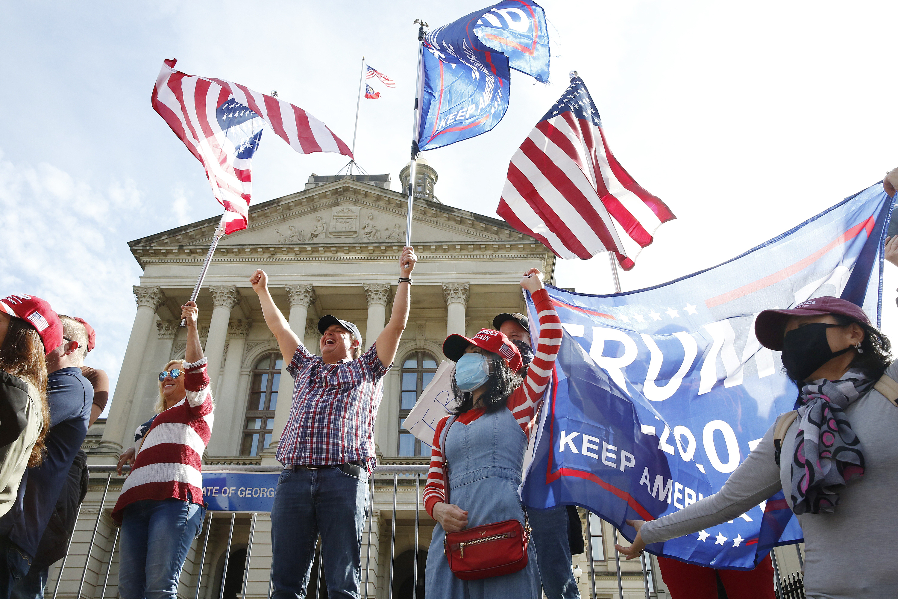Trump supporters gather after major news organisations called the US 2020 presidential election for Joe Biden, defeating incumbent US President Donald J Trump, at the Georgia State Capitol in Atlanta, Georgia. Biden has maintained a slim lead in the state