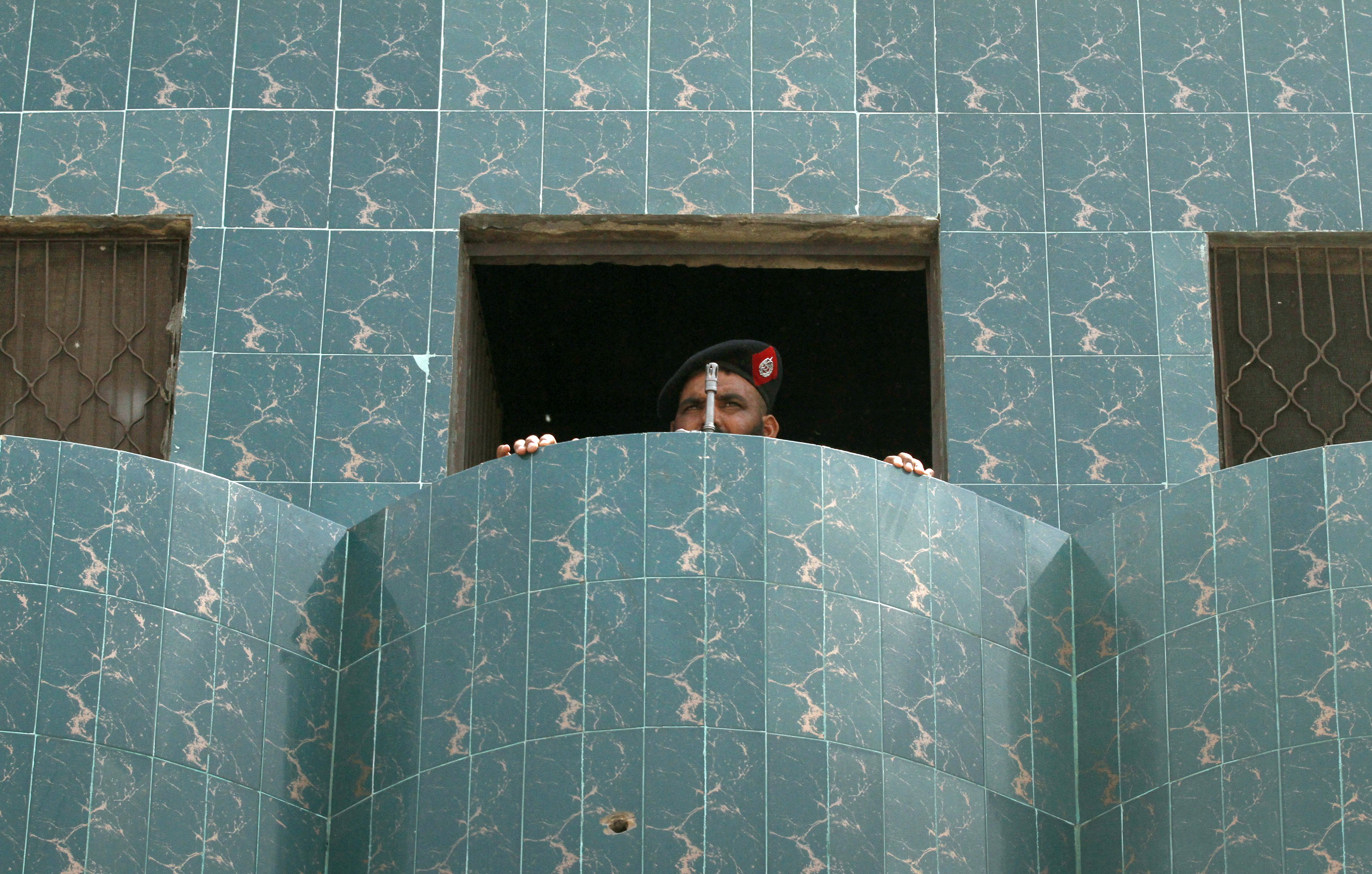 A policeman stands guard at the Data Darbar Sufi shrine in Lahore, which was targeted by suicide bombers in 2010, killing 42 people and injuring at least 175. It was attacked again in 2019