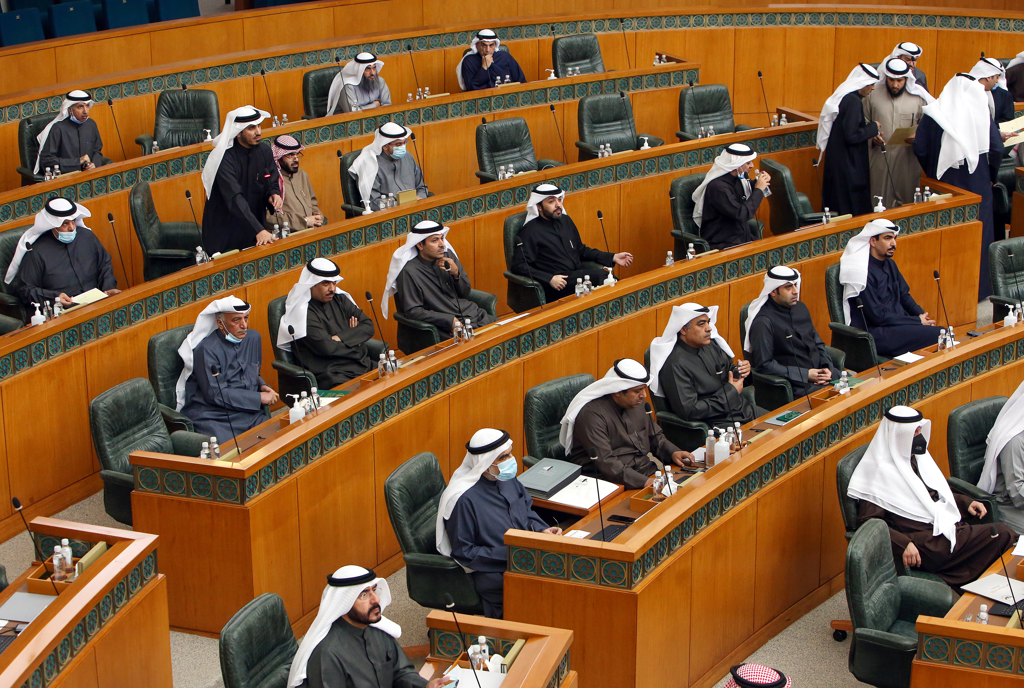 Kuwaiti MPs attend a parliament session