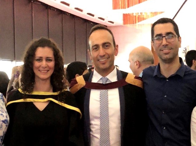 Concordia University engineering professor Ali Dolatabadi (centre) with former students Siavash Ghafouri-Azar (R) and Sara Mamani, at Mamani’s graduation in 2018. [Courtesy Ali Dolatabadi]