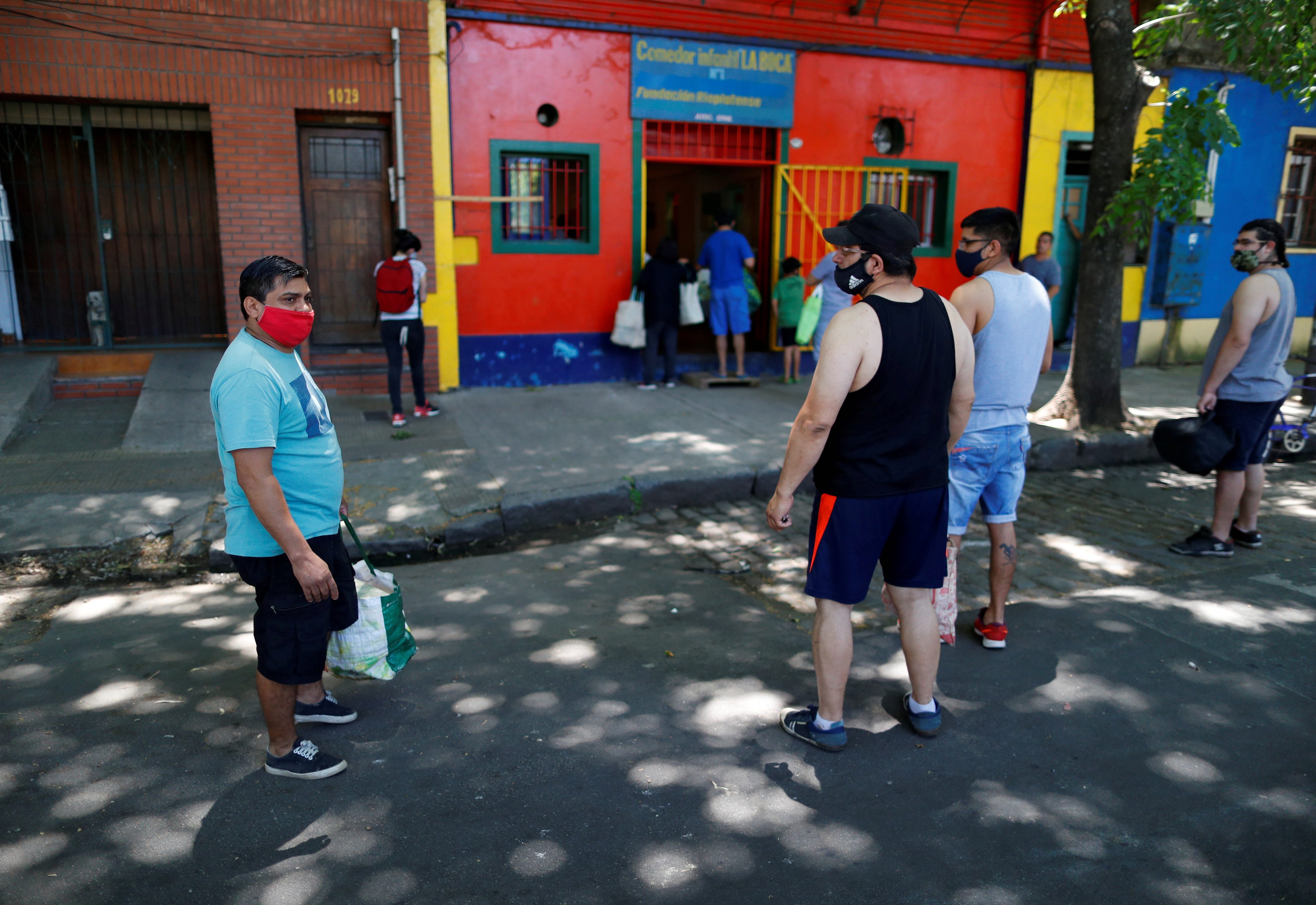 People waiting in line outside a soup kitchen in Buenos Aires, Argentina