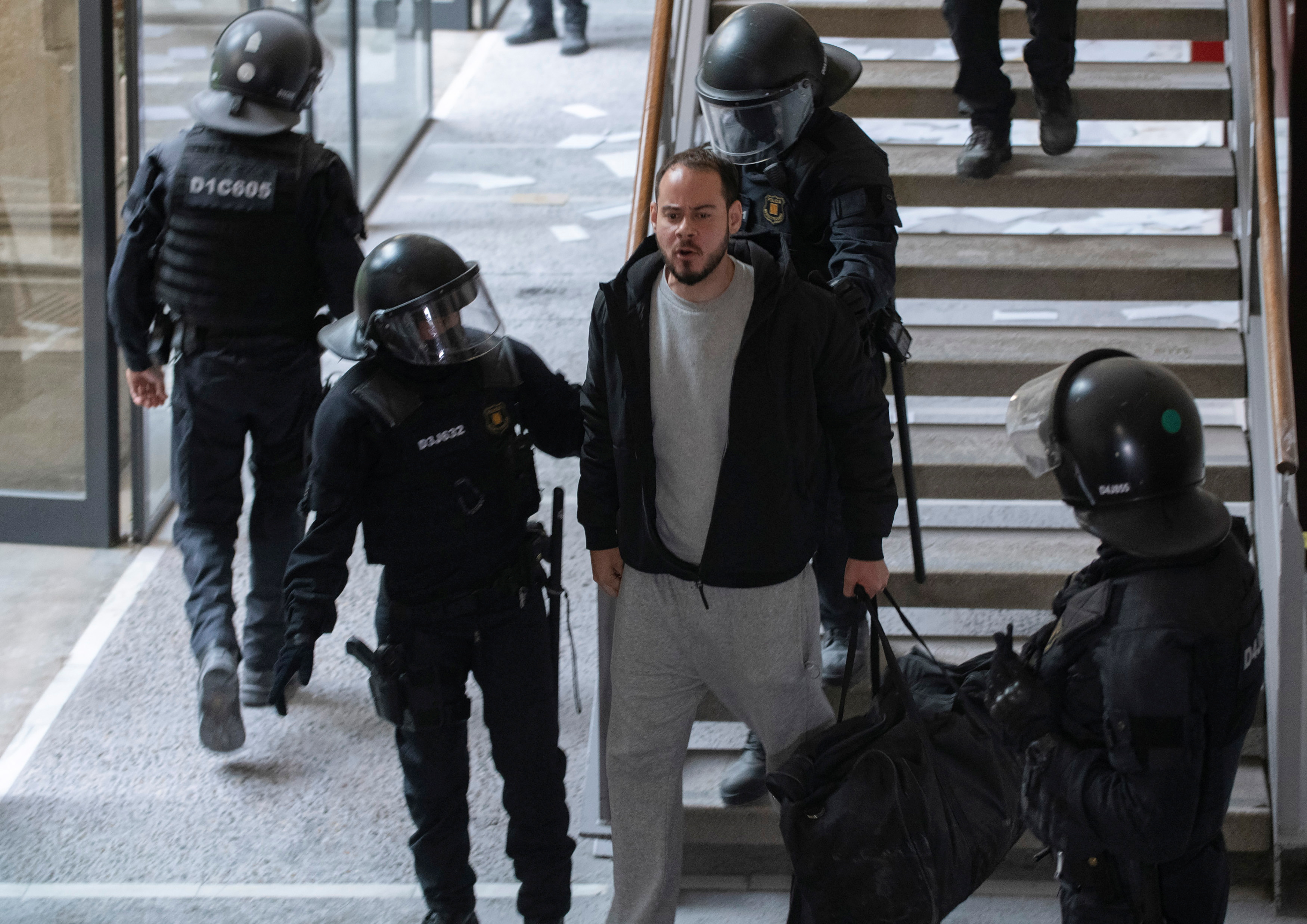 Pablo Hasel detained by riot police inside the University of Lleida, after he was sentenced to jail time on charges including insulting the monarchy and praising armed rebel groups, in Lleida