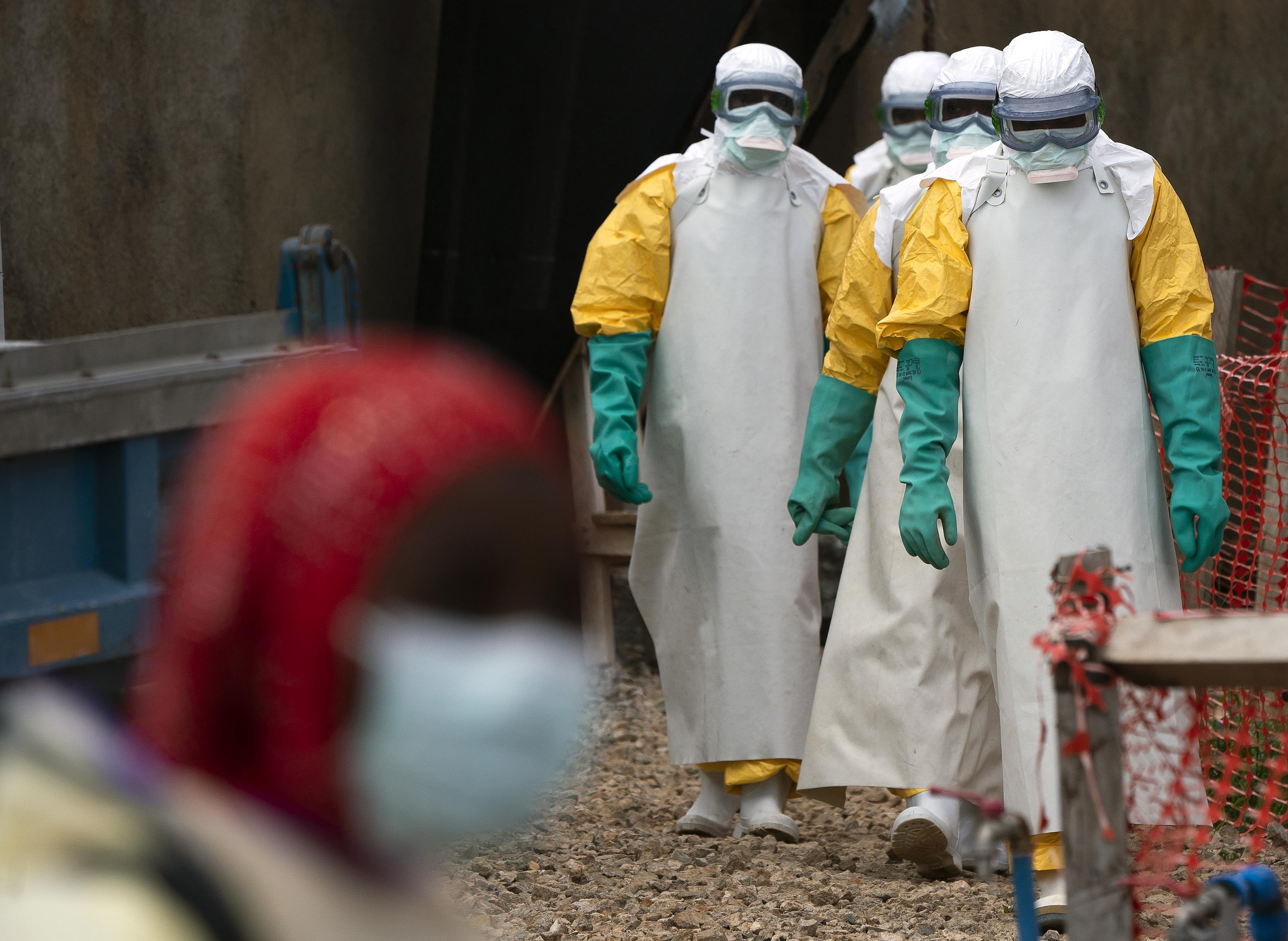 Health workers dressed in protective gear at an Ebola treatment centre in Beni [File: Jerome Delay/AP Photo]