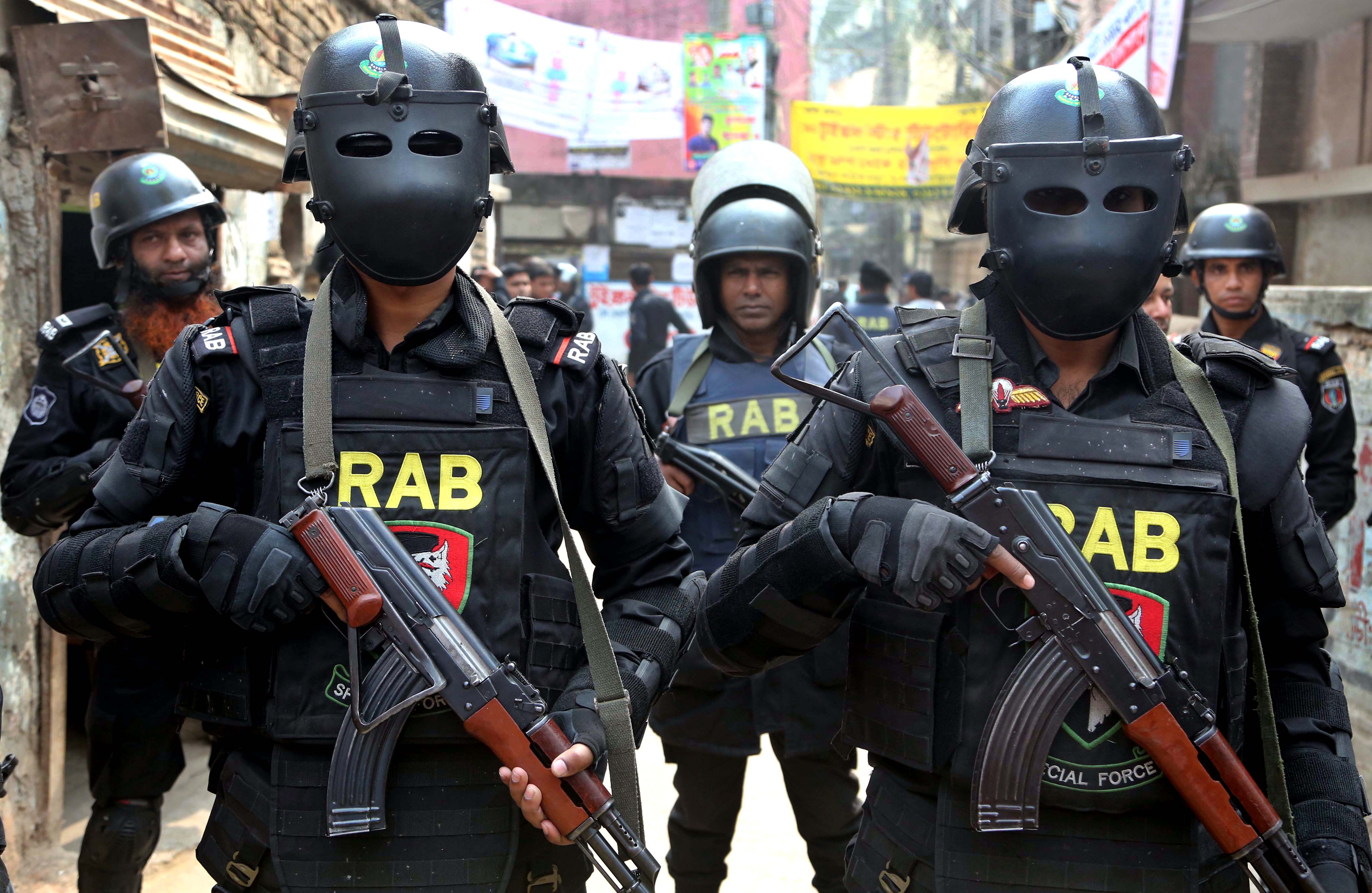 In their distinctive black uniforms, black headscarves and wraparound sunglasses, the force are as intimidating as they are clearly identifiable [Sony Ramany/NurPhoto via Getty Images]