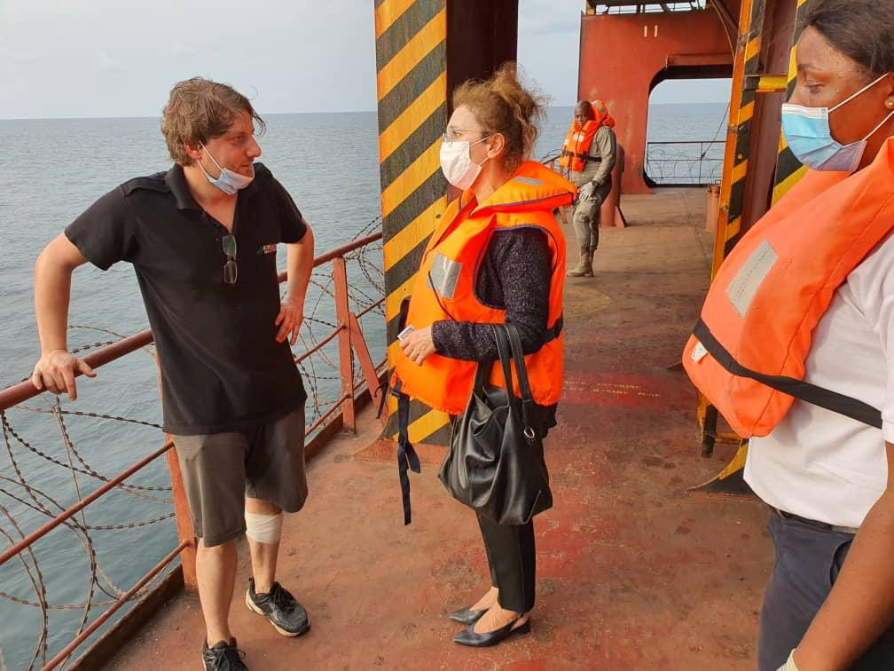 Turkish Ambassador to Libreville Nilufer Erdem Kaygisiz, centre, meets Turkish sailors on board the MV Mozart in January [Turkish Embassy in Libreville via Reuters]