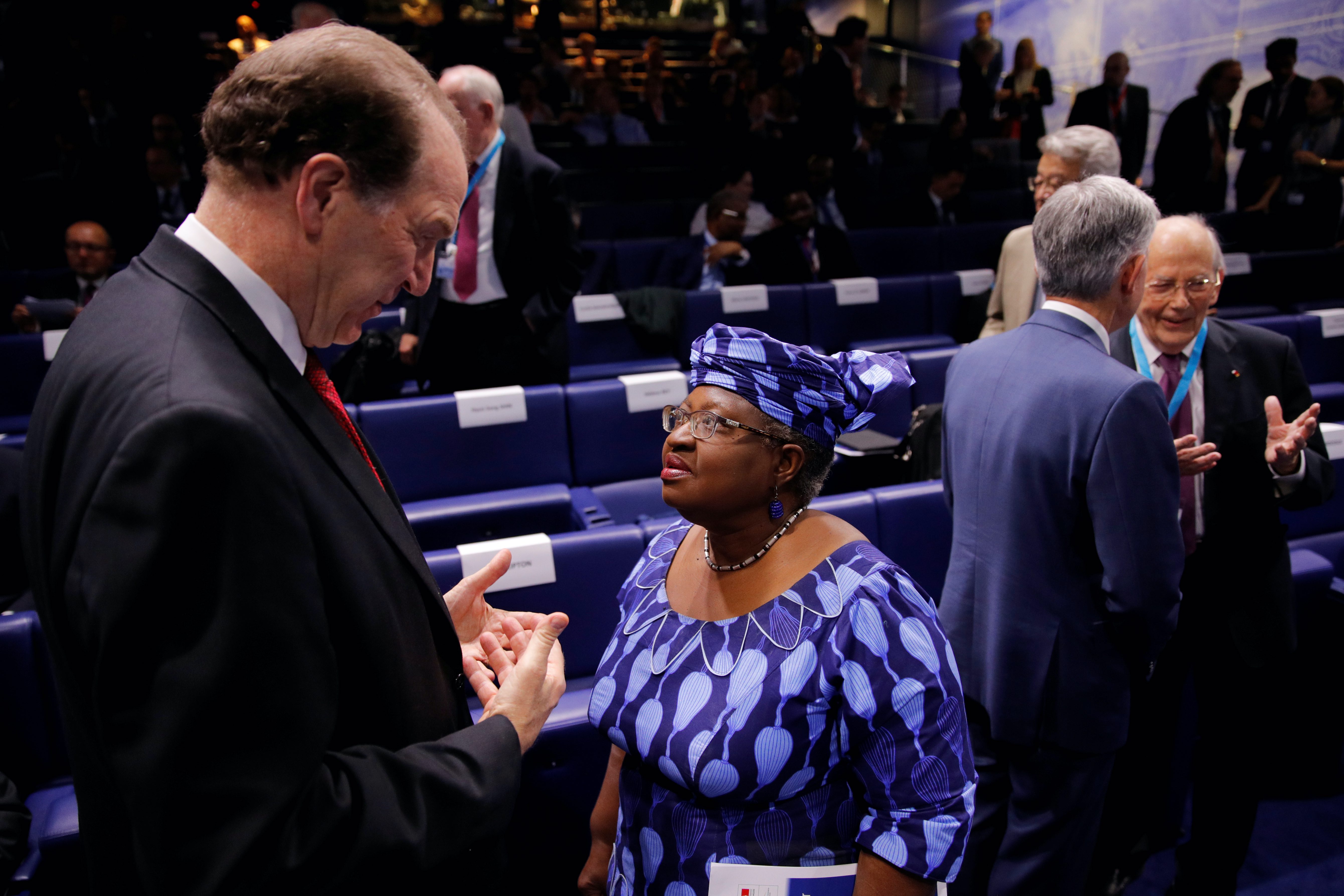 World Bank President David Malpass speaks with Ngozi Okonjo-Iweala, former finance minister of Nigeria, during a conference in Paris