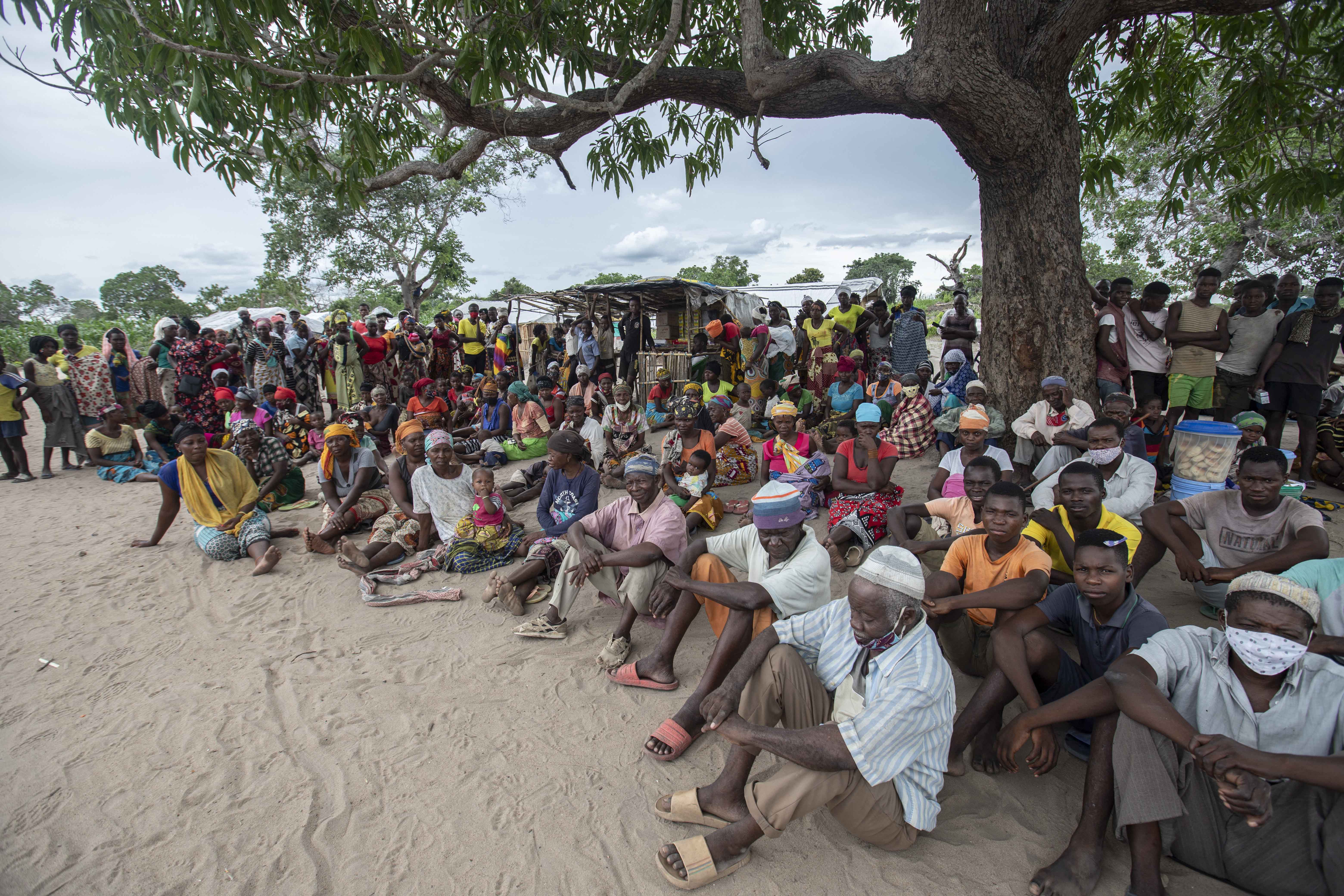People displaced by the violence in Cabo Delgado gather for a community meeting in the Tara Tara district of Matuge, northern Mozambique on February 24, 2021 [AFP/Alfredo Zuniga]