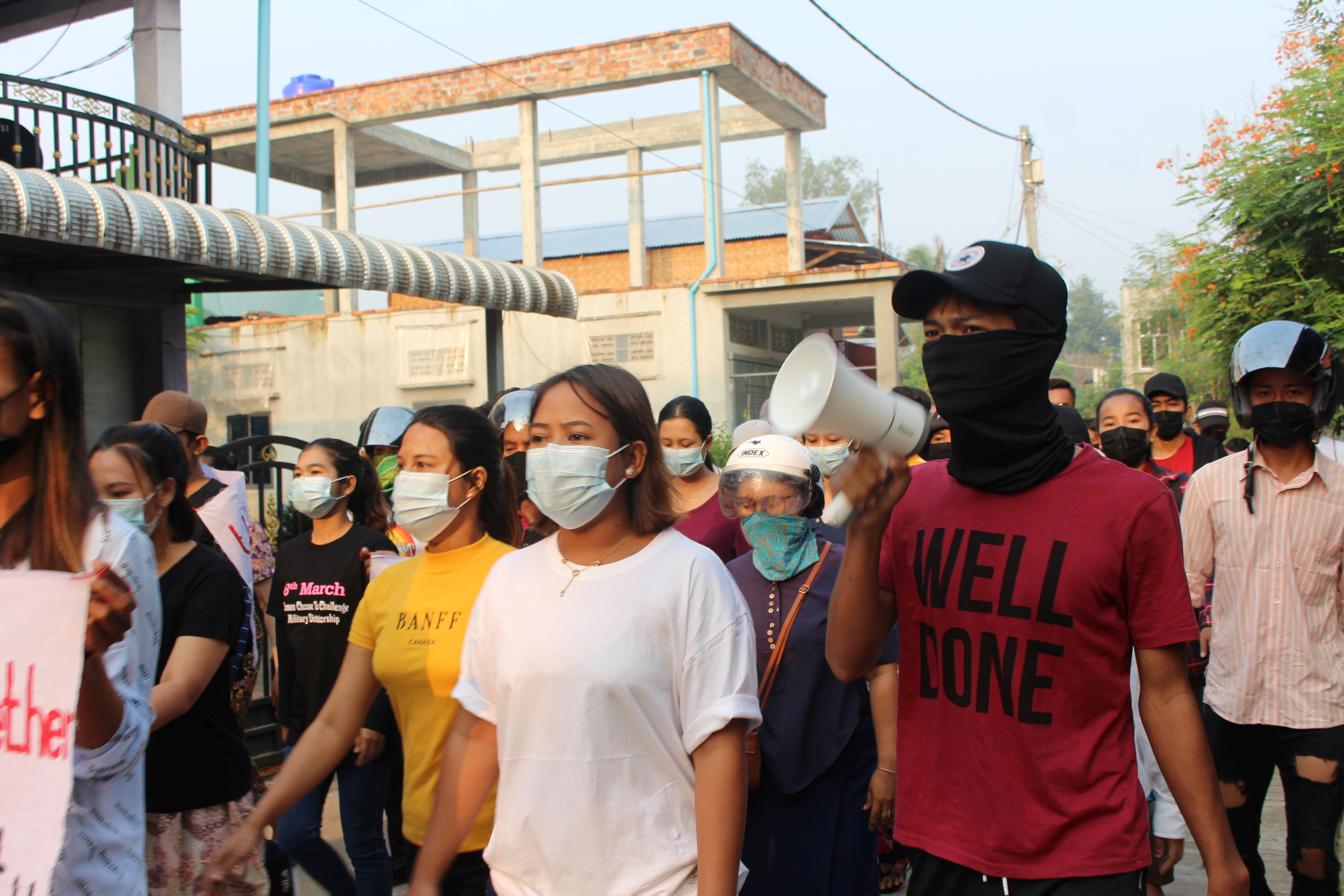 A demonstrator uses a bullhorn as university students and LGBTQ community members march against the coup in Dawei, Myanmar, on March 25, 2021 in this image obtained from social media [Dawei Watch via Reuters]