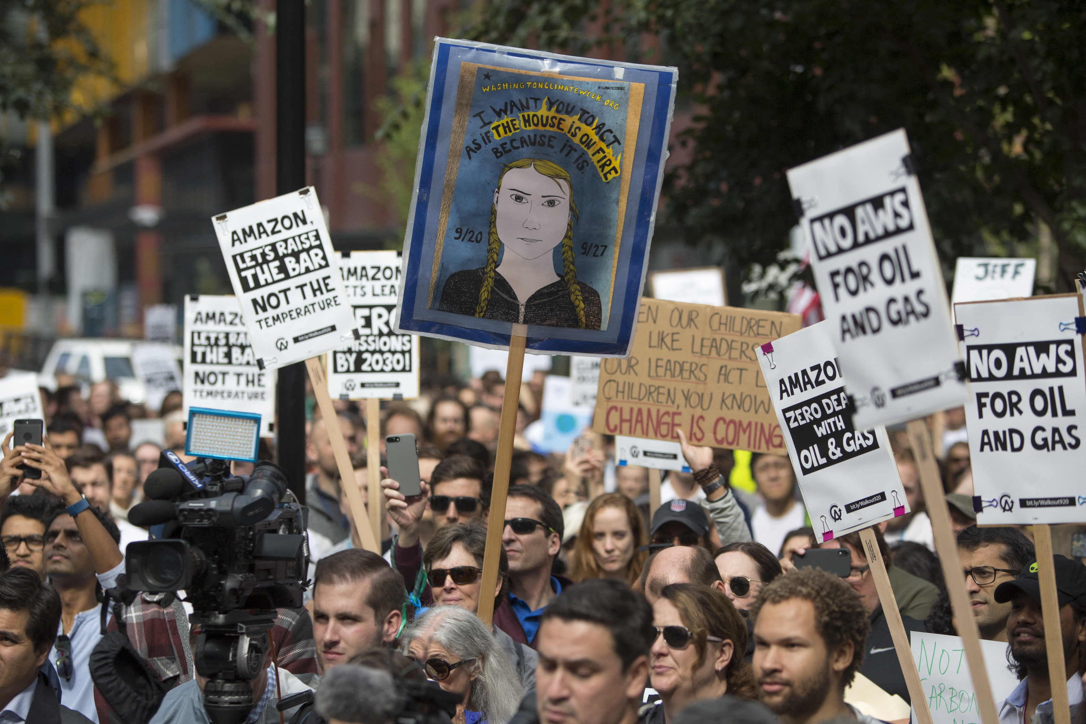 Amazon Employees for Climate Justice lead a walk out and rally at the company's headquarters to demand that leaders take action on climate change in Seattle, in the US state of Washington on September 20, 2019 [Jason Redmond/AFP]