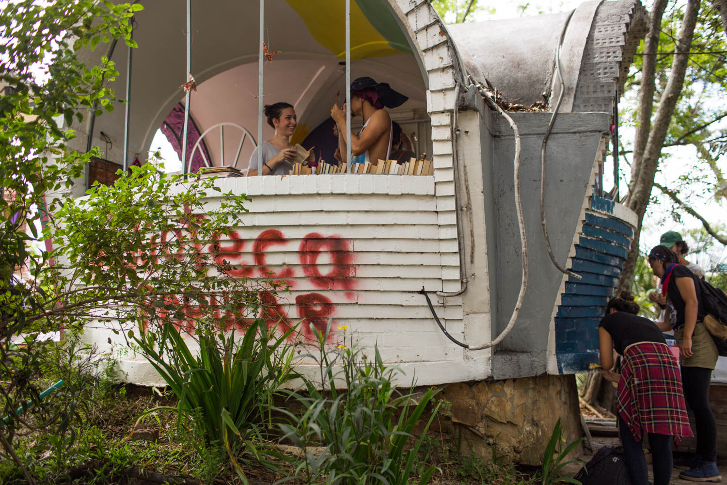 A small police station that was burned during the early days of the protest has been adapted as a 'popular library' in the neighbourhood of San Antonio. [Mauricio Morales/Al Jazeera]