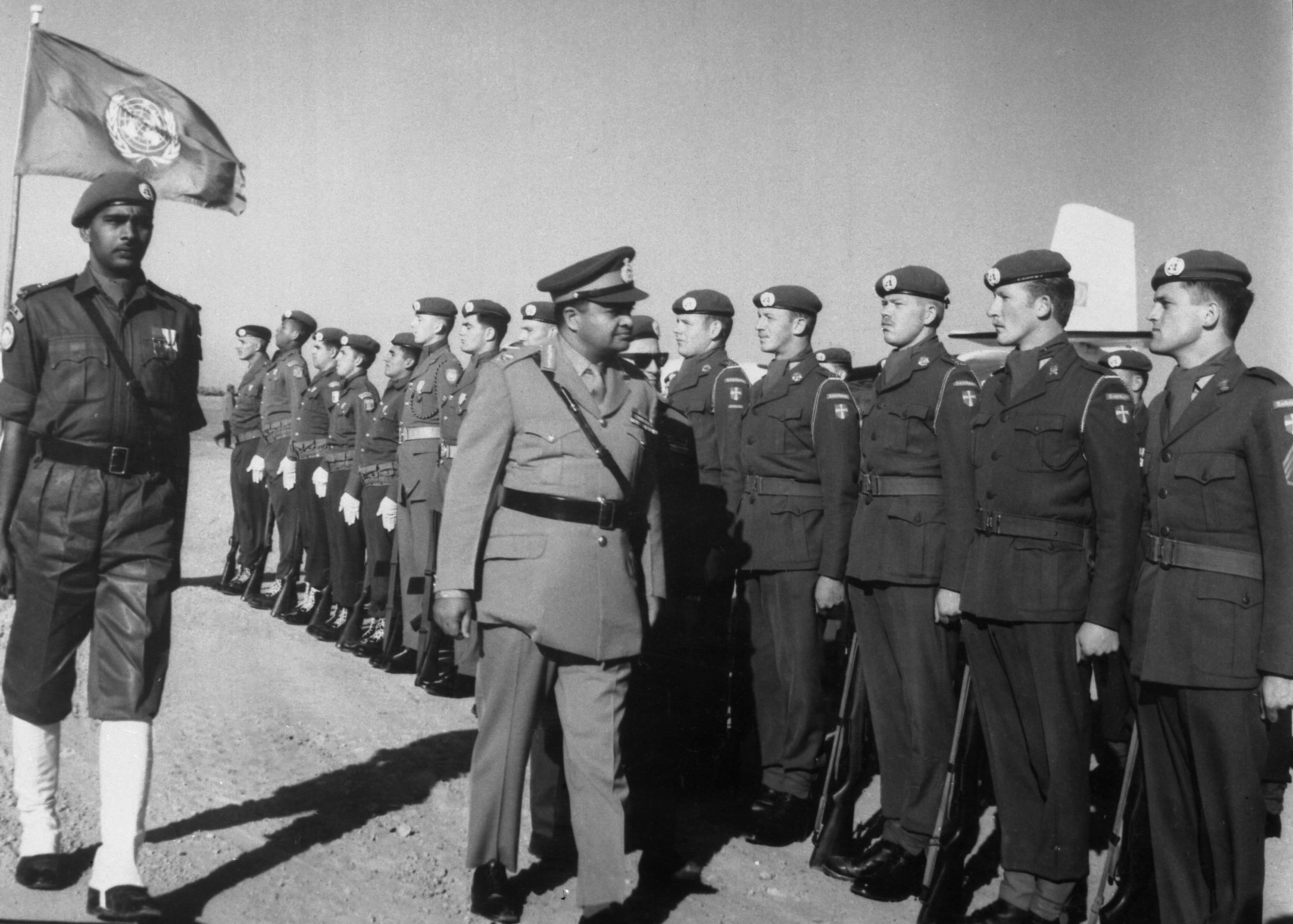 Major General Indar Jit Rikyhe of India reviews a guard of honour on arrival at the Gaza Strip Airfield on January 29, 1966 to take over as commander of the United Nations Emergency Force in the Gaza Strip [File: AP]