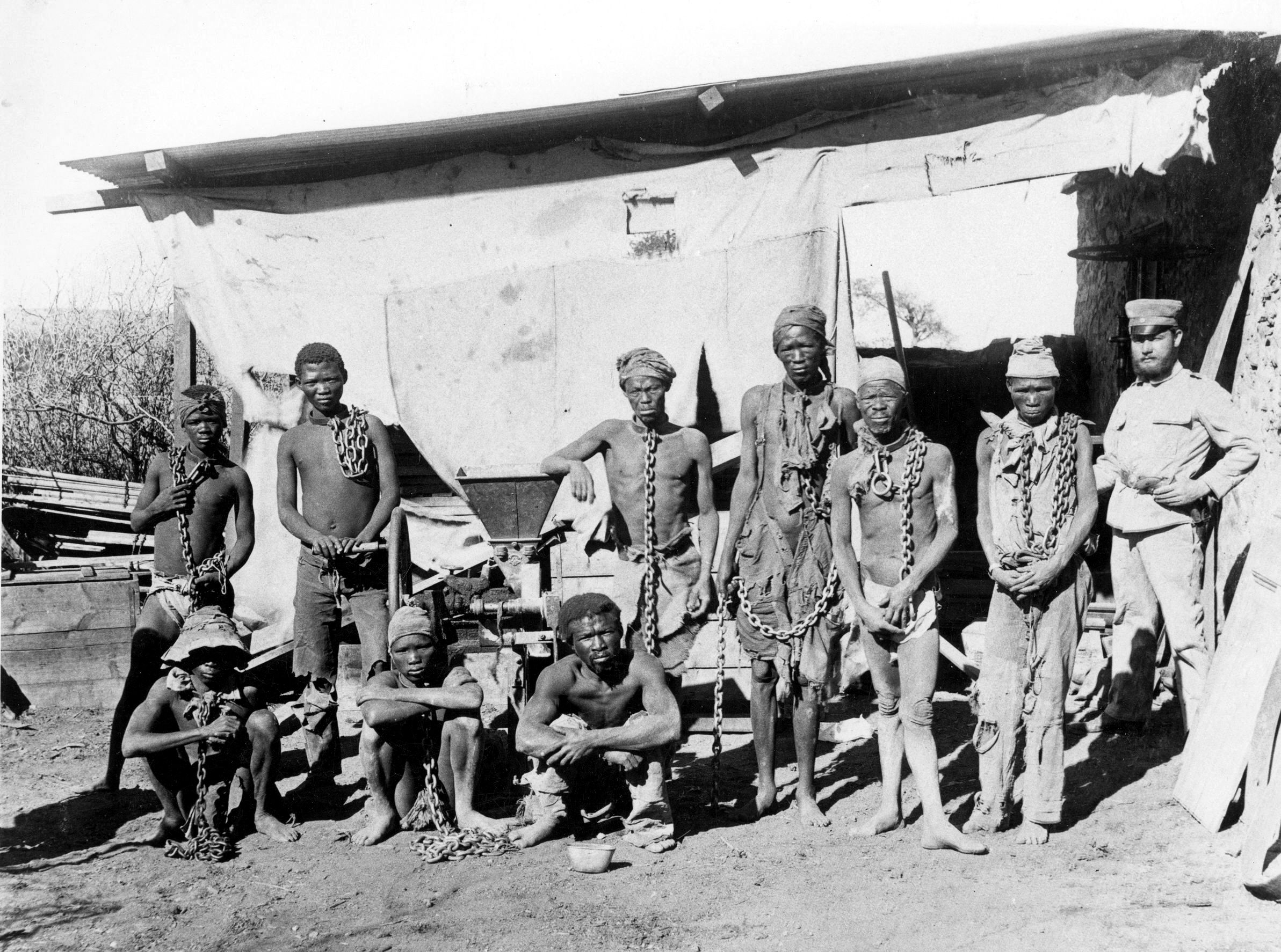 A photo taken during the 1904-1908 genocide in Namibia shows men in chains