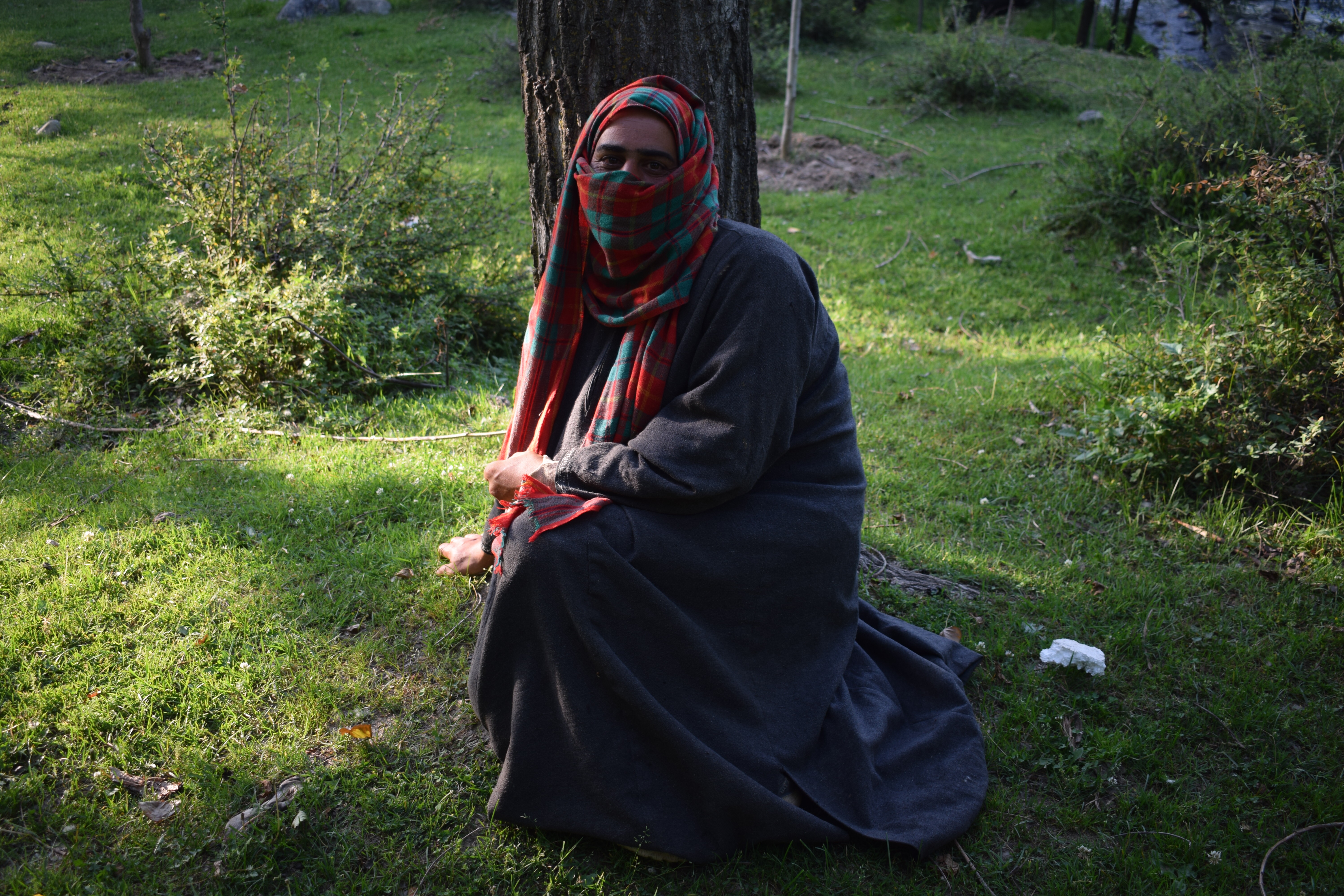 Muskaan resting on the bank of Veshaw river after 10 long hours of mining the riverbed