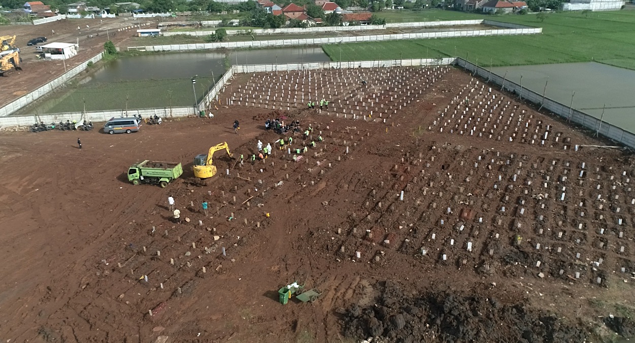 The cemetery at Rorotan has been built on what was once a swamp in northern Jakarta