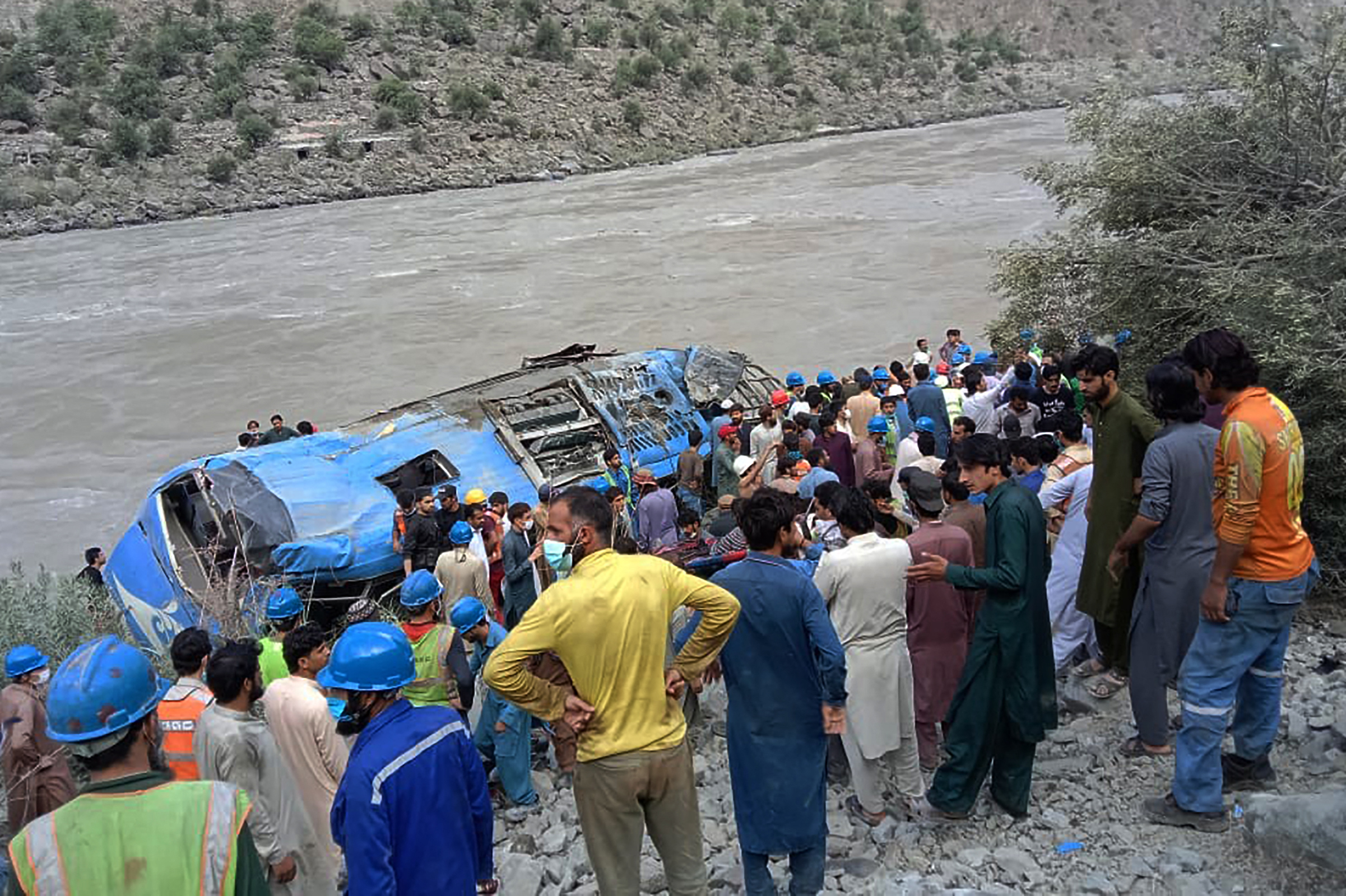 Rescue workers and onlookers gather