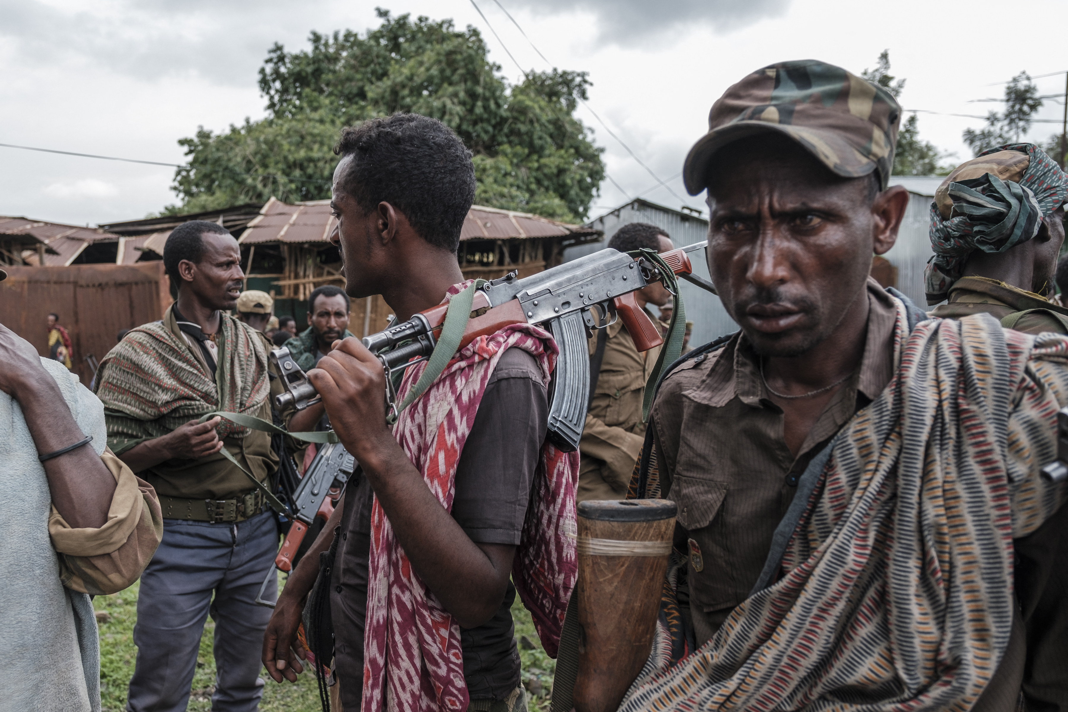 Members of the Amhara militia gather in the village of Adi Arkay, 180 kilometers northeast from the city of Gondar, Ethiopia, on July 14, 2021. - On Wednesday the Amhara government spokesman Gizachew Muluneh announced that regional special forces and militias would shift to "attack" mode to reverse the recent battlefield gains by the Tigrayan rebels. His statement appeared just hours after Prime Minister Abiy Ahmed, winner of the 2019 Nobel Peace Prize, vowed to "repel" attacks by Ethiopias enemies. (Photo by EDUARDO SOTERAS / AFP) (AFP)