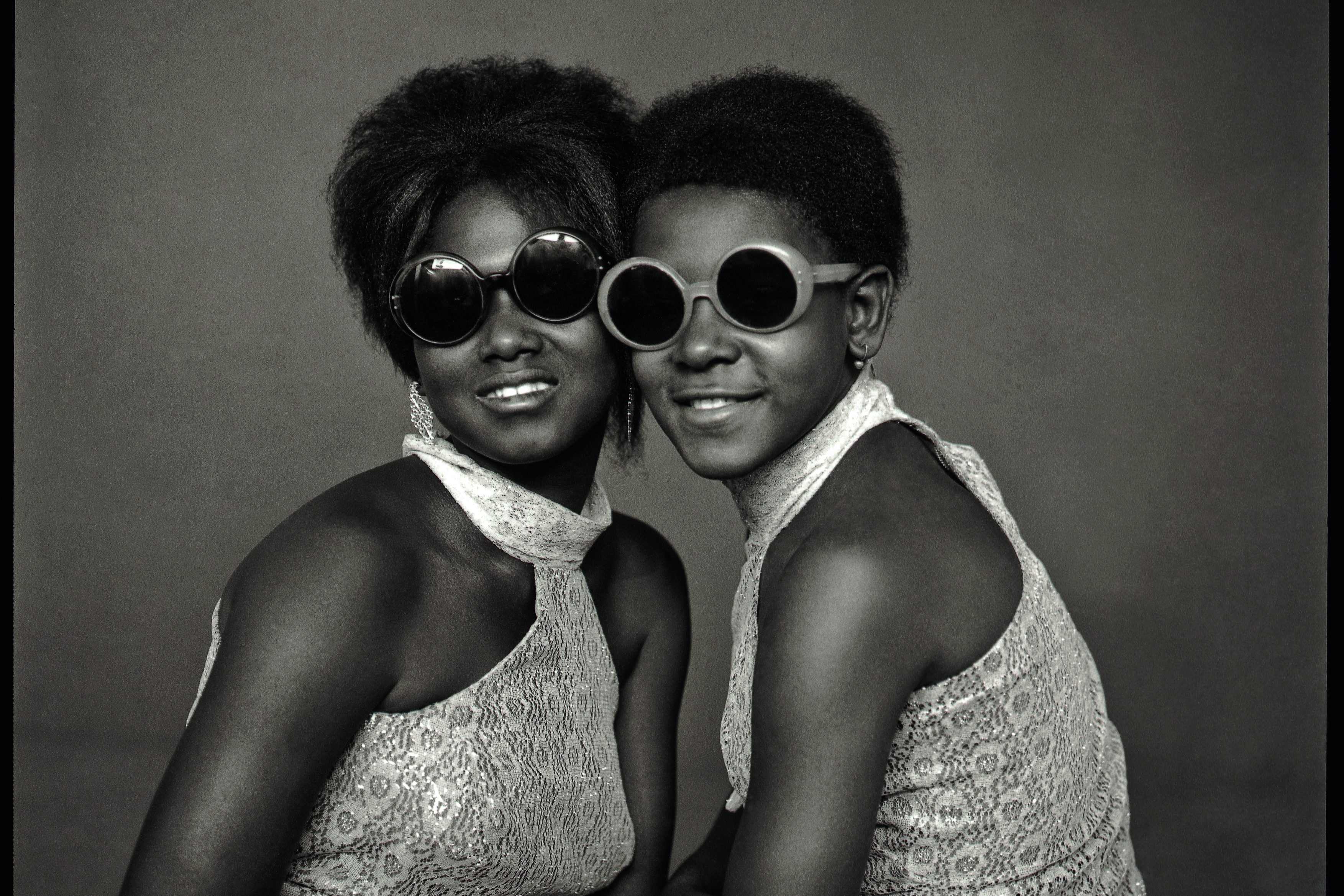 Two Young Yé-Yé Girls with Sunglasses, 1965, Abdourahmane Sakaly, Mali [Courtesy of the Estate of Abdourahmane Sakaly, Bamako, Mali and Revue Noire, Paris/The McKinley Collection]