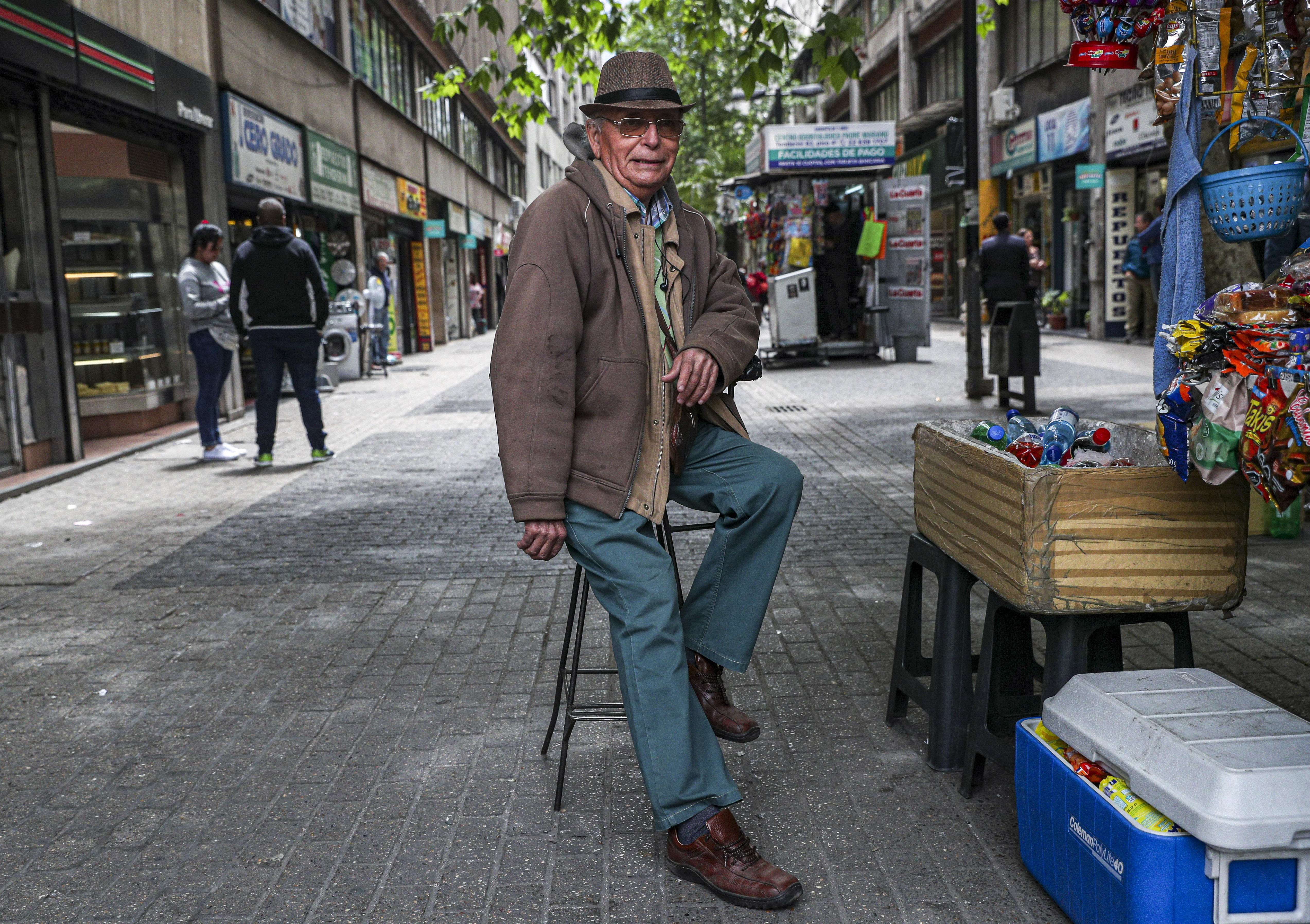 Some retired people, like Emilio Monardes, 78, a street merchant in downtown Santiago, Chile, turn to informal sector work to bolster their meagre pensions in old age