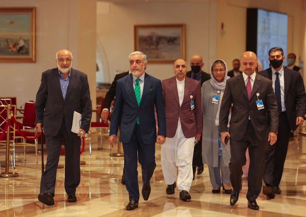 Head of Afghanistan's High Council for National Reconciliation Abdullah Abdullah walks in a hotel lobby in Qatar's capital Doha during an international meeting on the escalating conflict in Afghanistan on August 10, 2021 [Karim Jaafar/AFP]