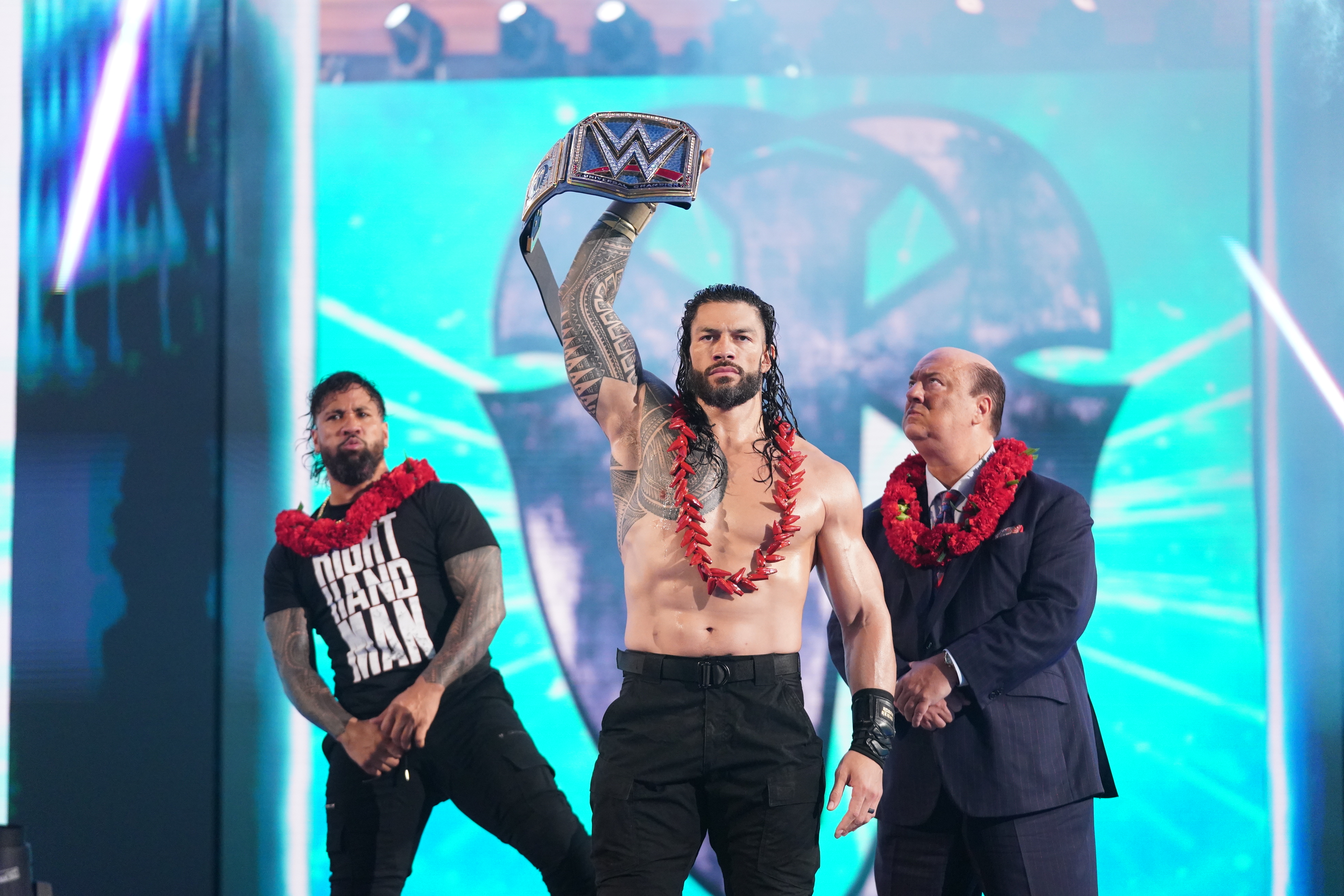 Roman Reigns holds up the WWE Universal Championship [WWE]