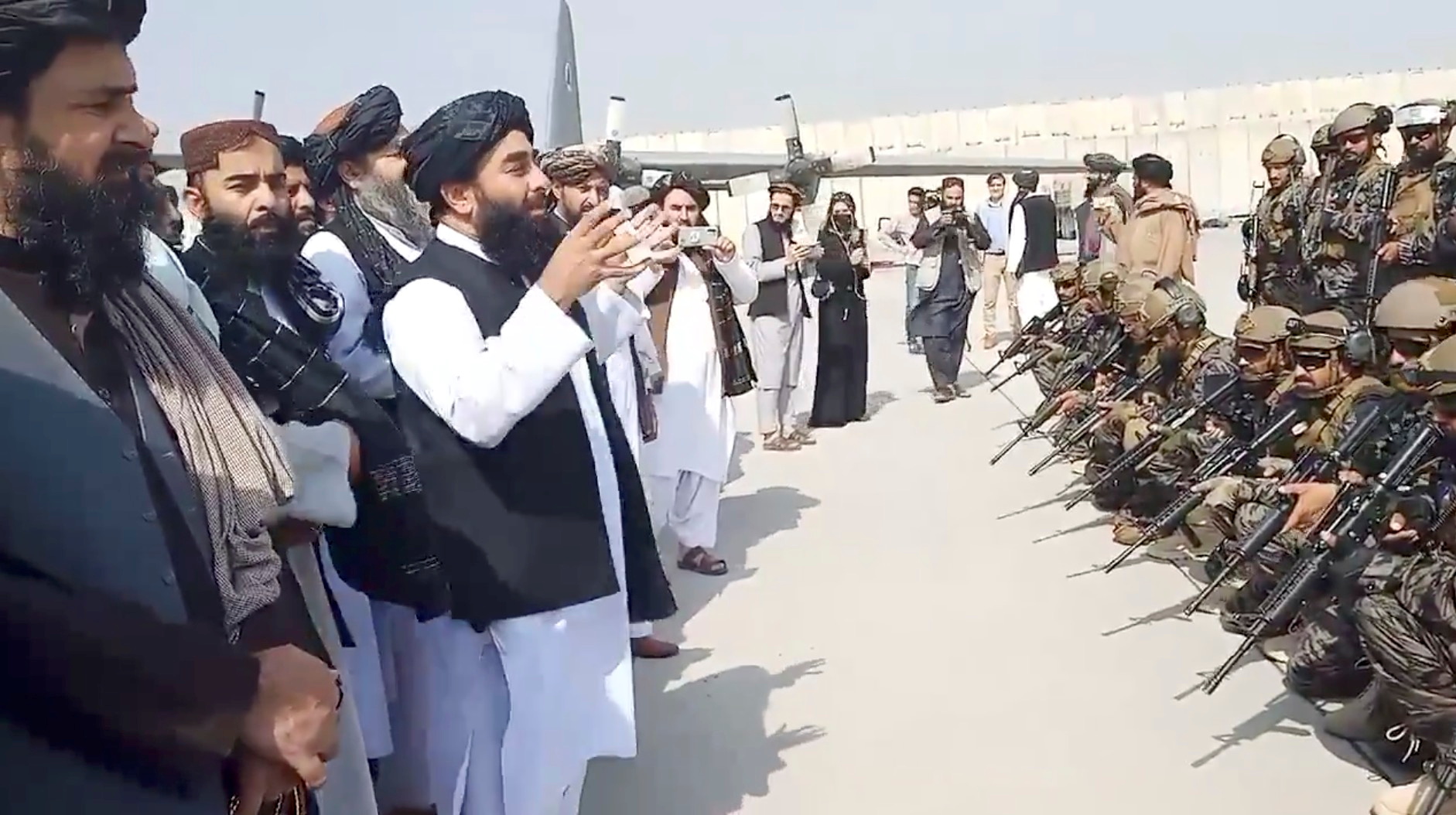 Taliban spokesman Zabihullah Mujahid speaks to Badri 313 military unit at Kabul’s airport