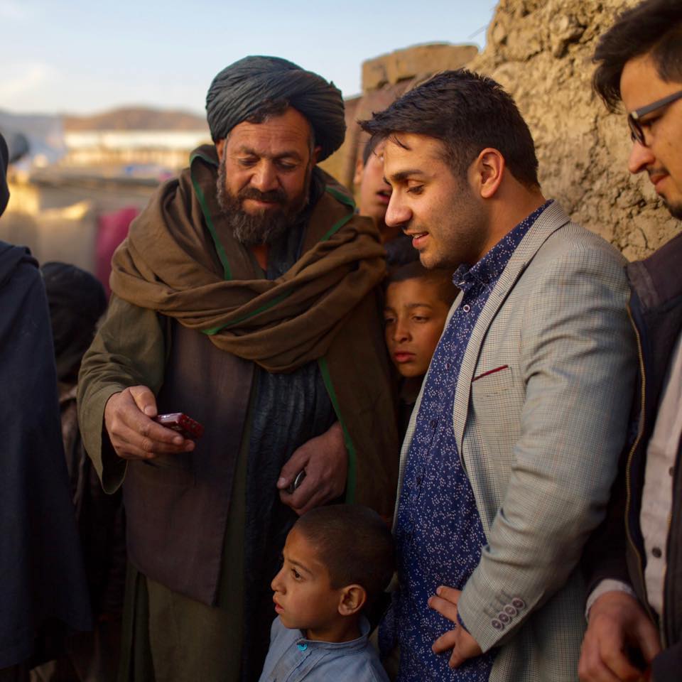 Afghan entrepreneur Nasrat Khalid (right) turned the e-commerce platform he founded into a way to help distribute aid such as diapers, baby formula, food, clothing and tents to people in need [Courtesy: Kern Hendricks/Aseel]