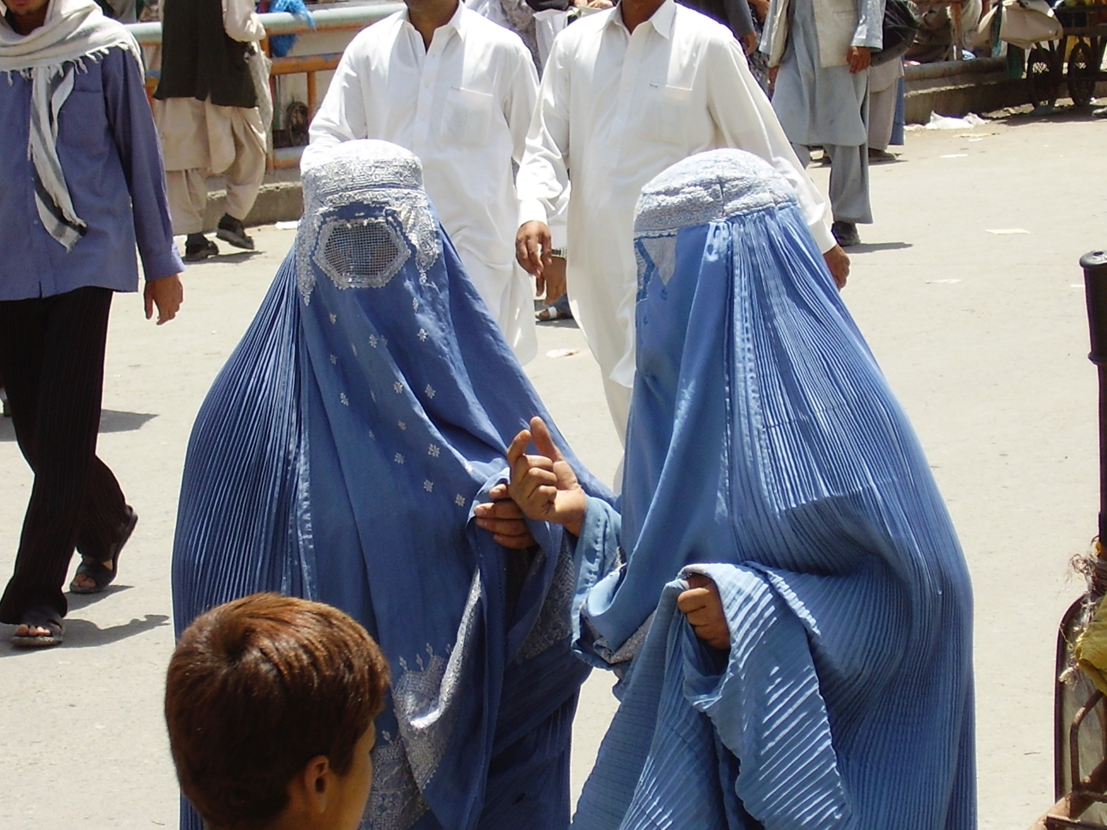 Women are pictured on a street in Kabul in 2007