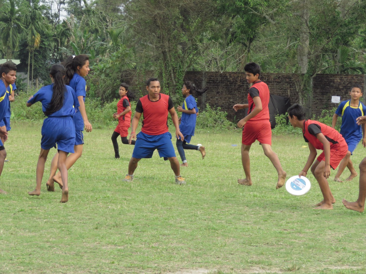 Players enjoy a game of ultimate frisbee in Rowmari, Chirang district, Assam [Maitreyee Boruah/Al Jazeera]