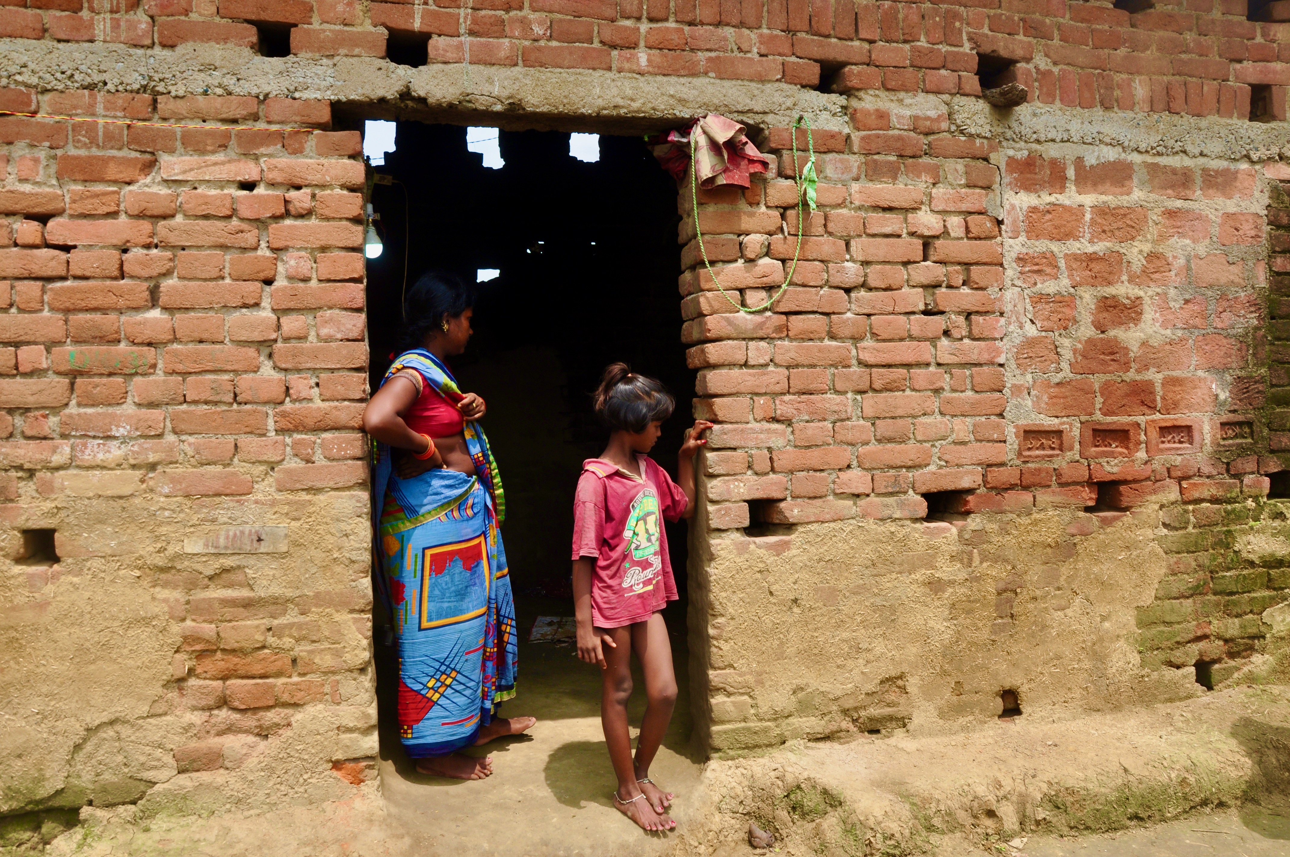 The Manjhis’ home is made of brick and mud, left half-unplastered. Shashikant, 13, was trafficked from this village in 2019