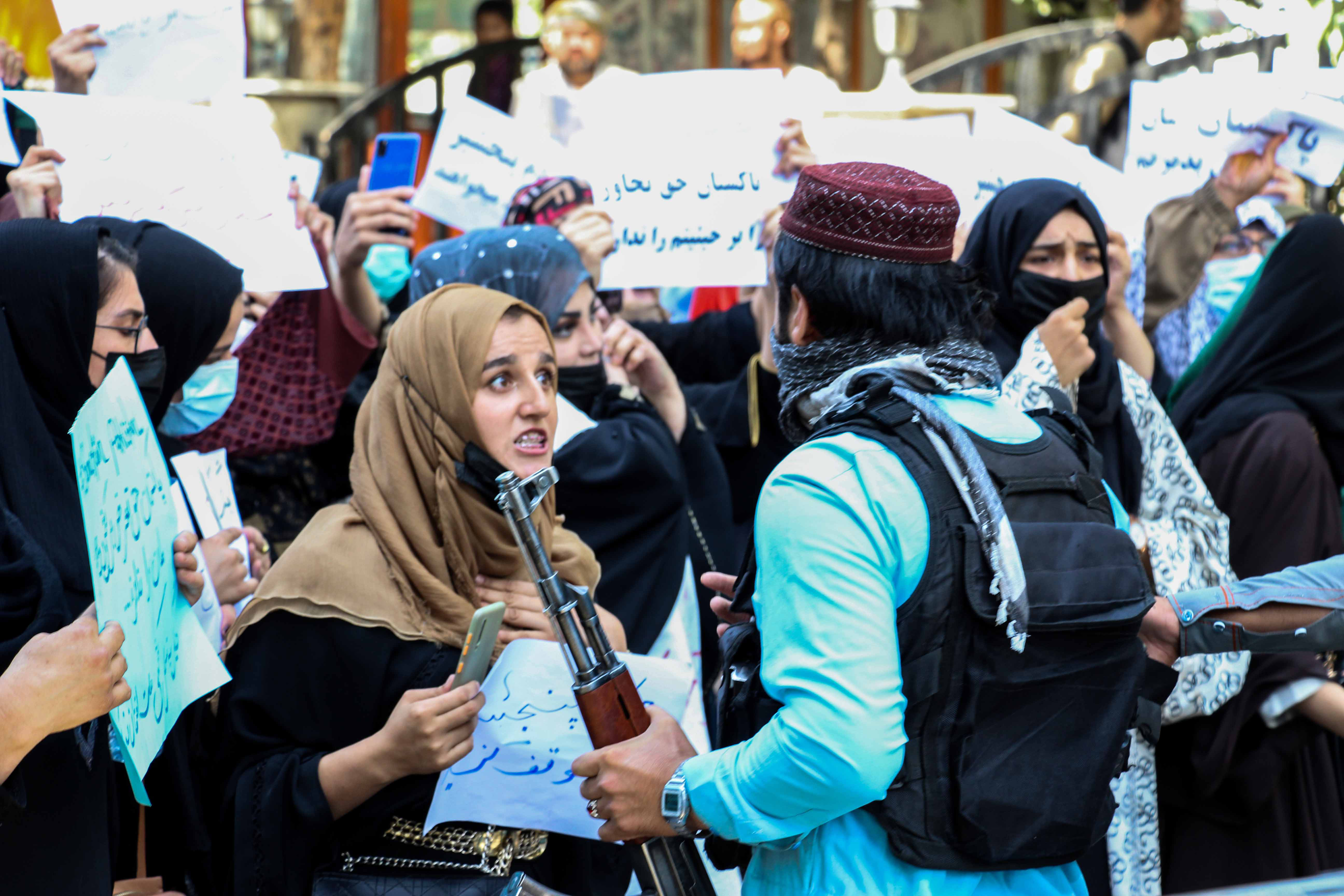 Afghans hold placards and shout anti-Pakistan slogans during a protest in Kabul, Afghanistan [EPA]