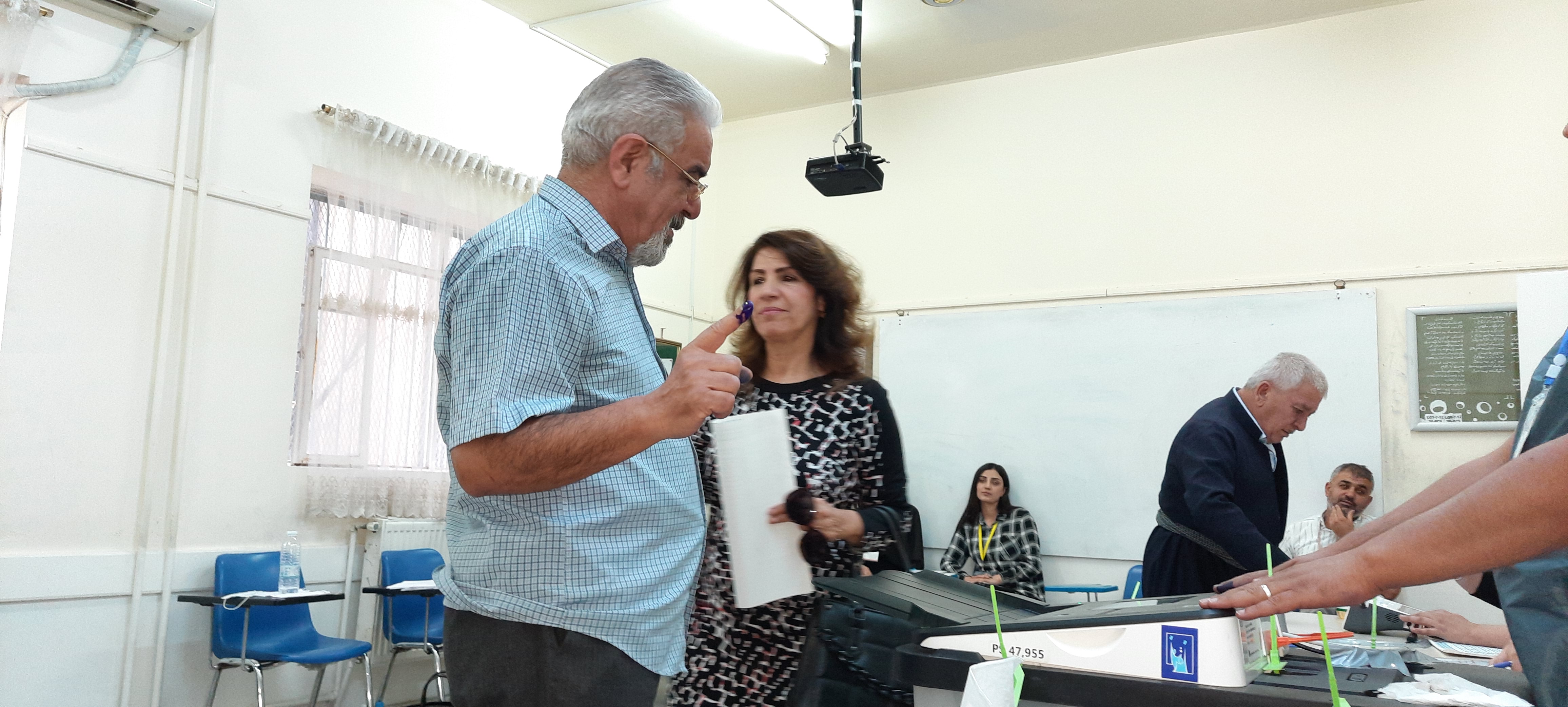 Barzan Wahab, an artist, and his wife vote on Sunday in Sulaimaniyah city