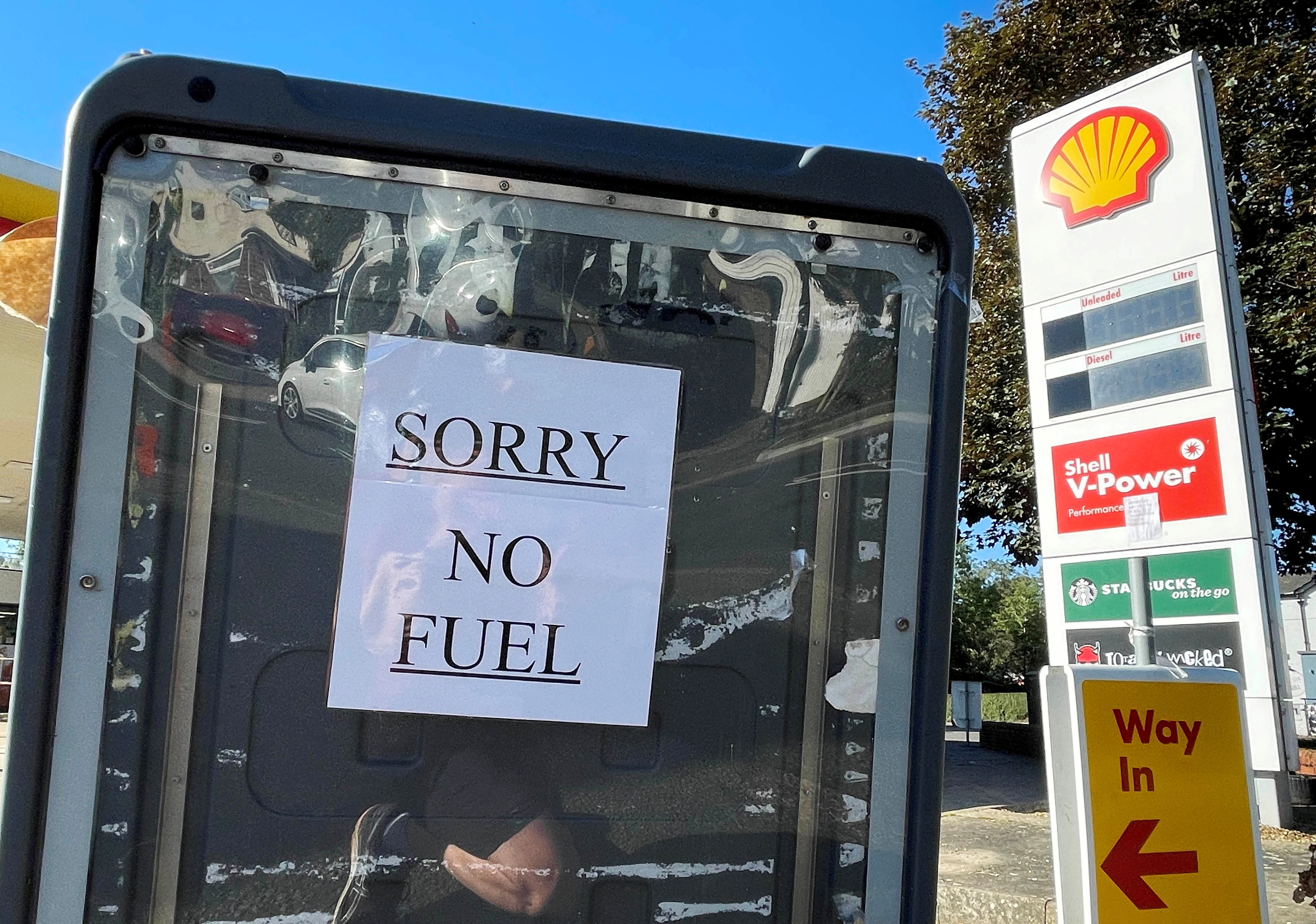 A sign informs customers that fuel has run out at a petrol station in Hemel Hempstead, Britain